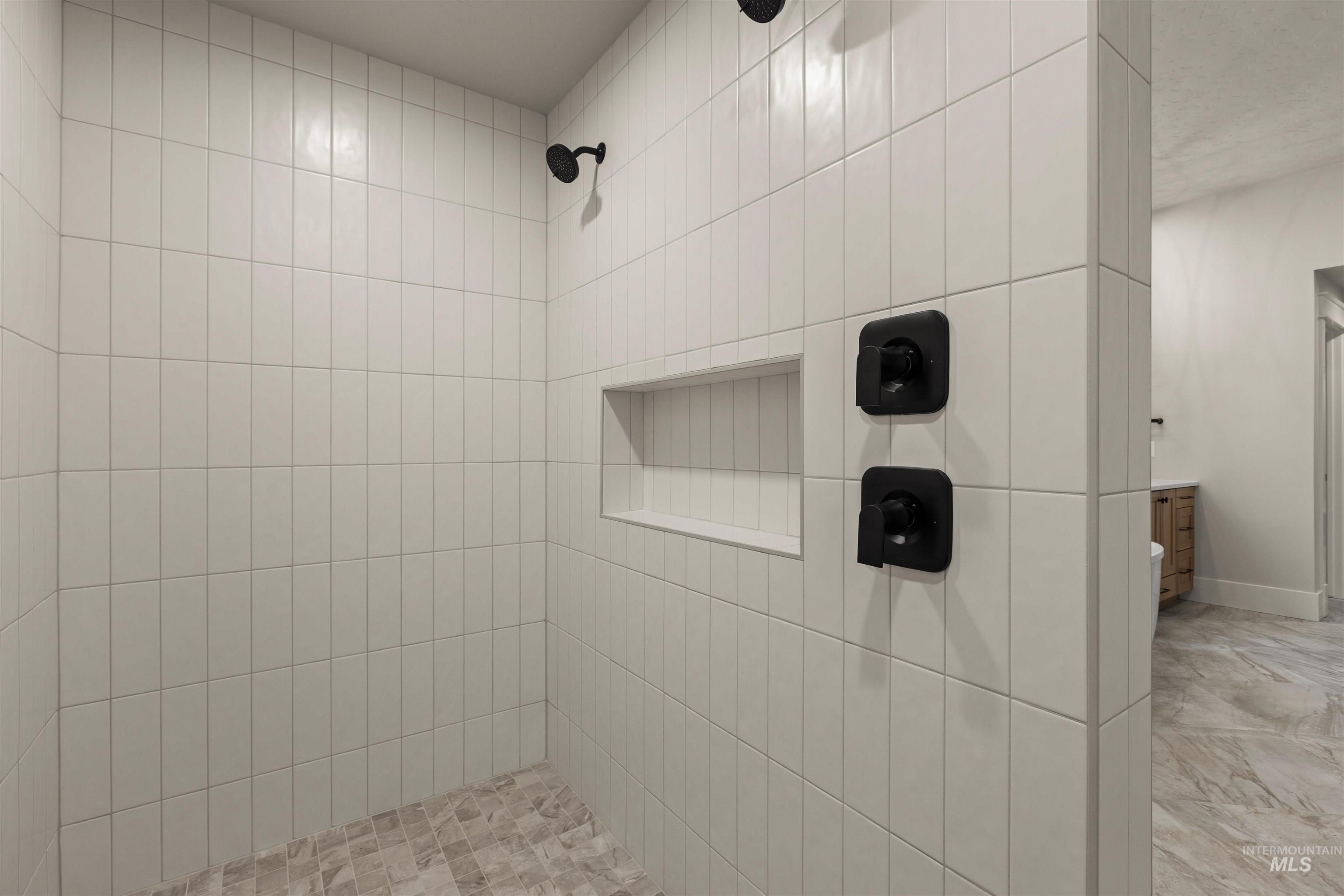 6844 South Messner Way Meridian, ID 83642 - Photo 27 of 49 Bathroom featuring a tile shower