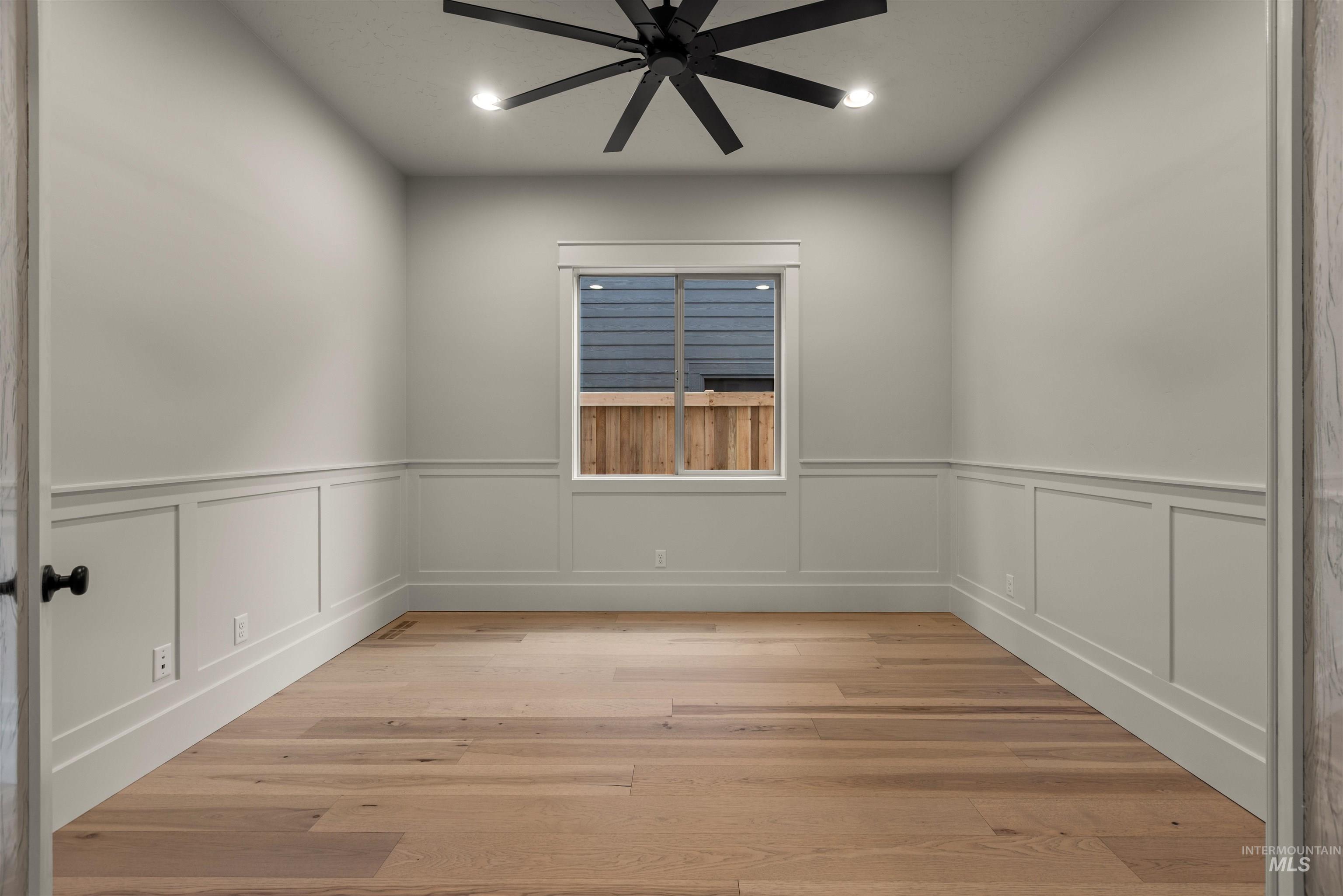 6844 South Messner Way Meridian, ID 83642 - Photo 34 of 49 Unfurnished room featuring recessed lighting, ceiling fan, light wood-style flooring, and a wainscoted wall