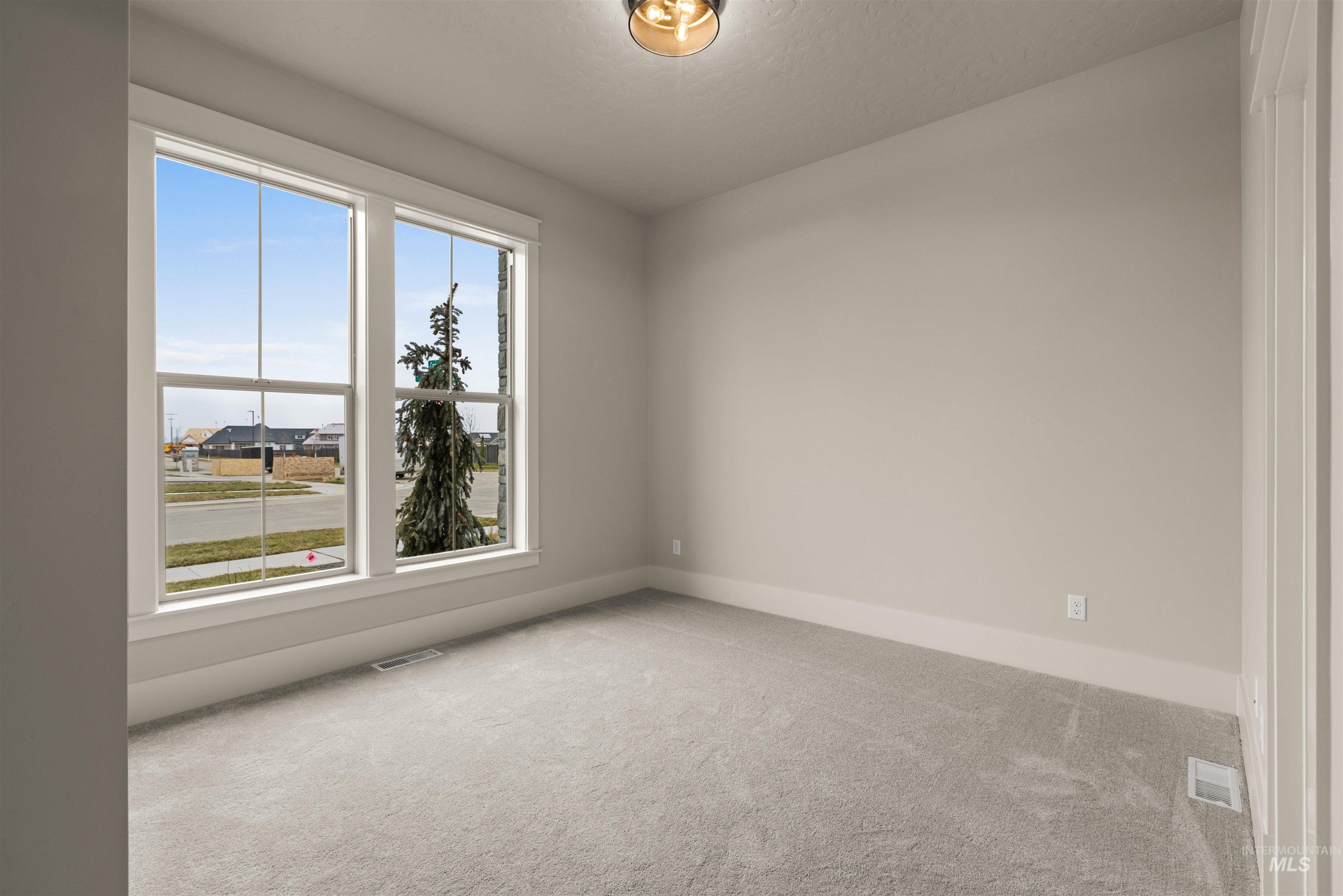 6844 South Messner Way Meridian, ID 83642 - Photo 4 of 49 Empty room featuring carpet and baseboards