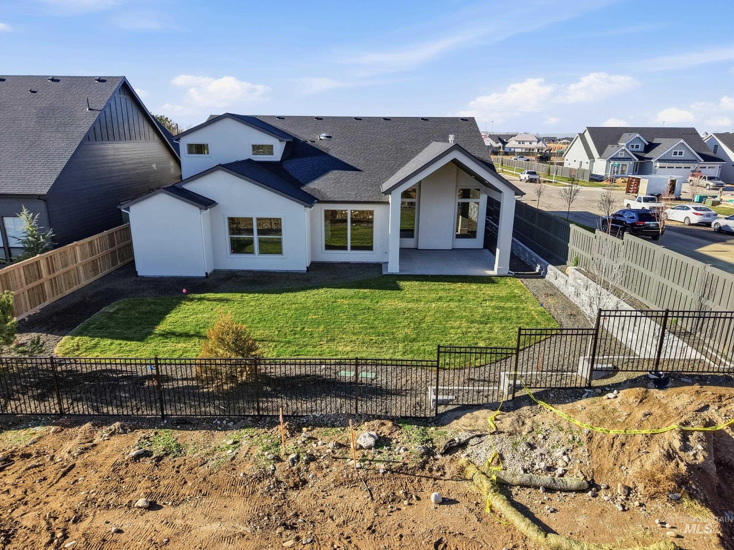 6844 South Messner Way Meridian, ID 83642 - Photo 42 of 49 Rear view of property featuring a patio, stucco siding, a shingled roof, and a fenced backyard