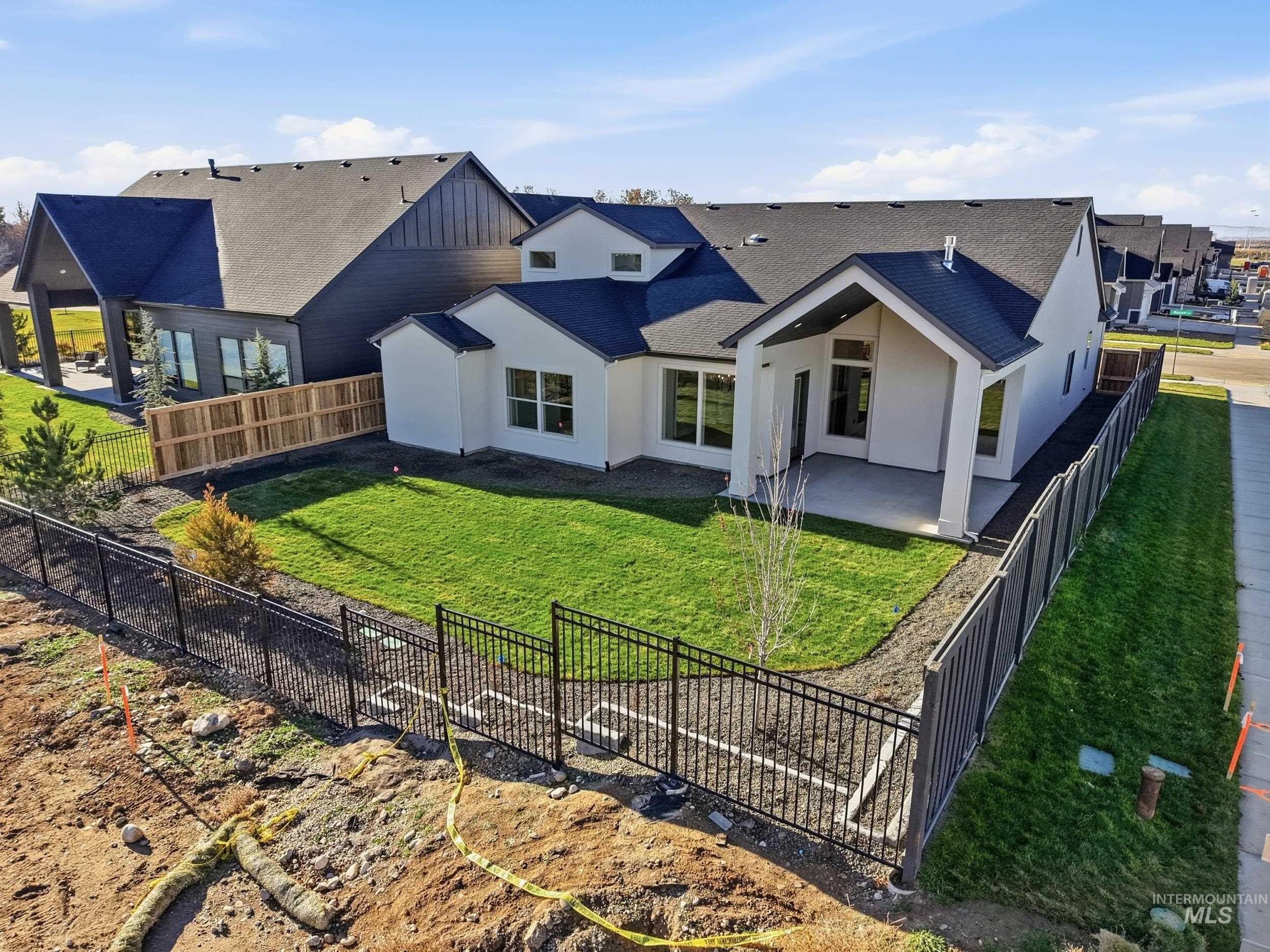 6844 South Messner Way Meridian, ID 83642 - Photo 43 of 49 Rear view of house with a patio area, a shingled roof, stucco siding, and a fenced backyard