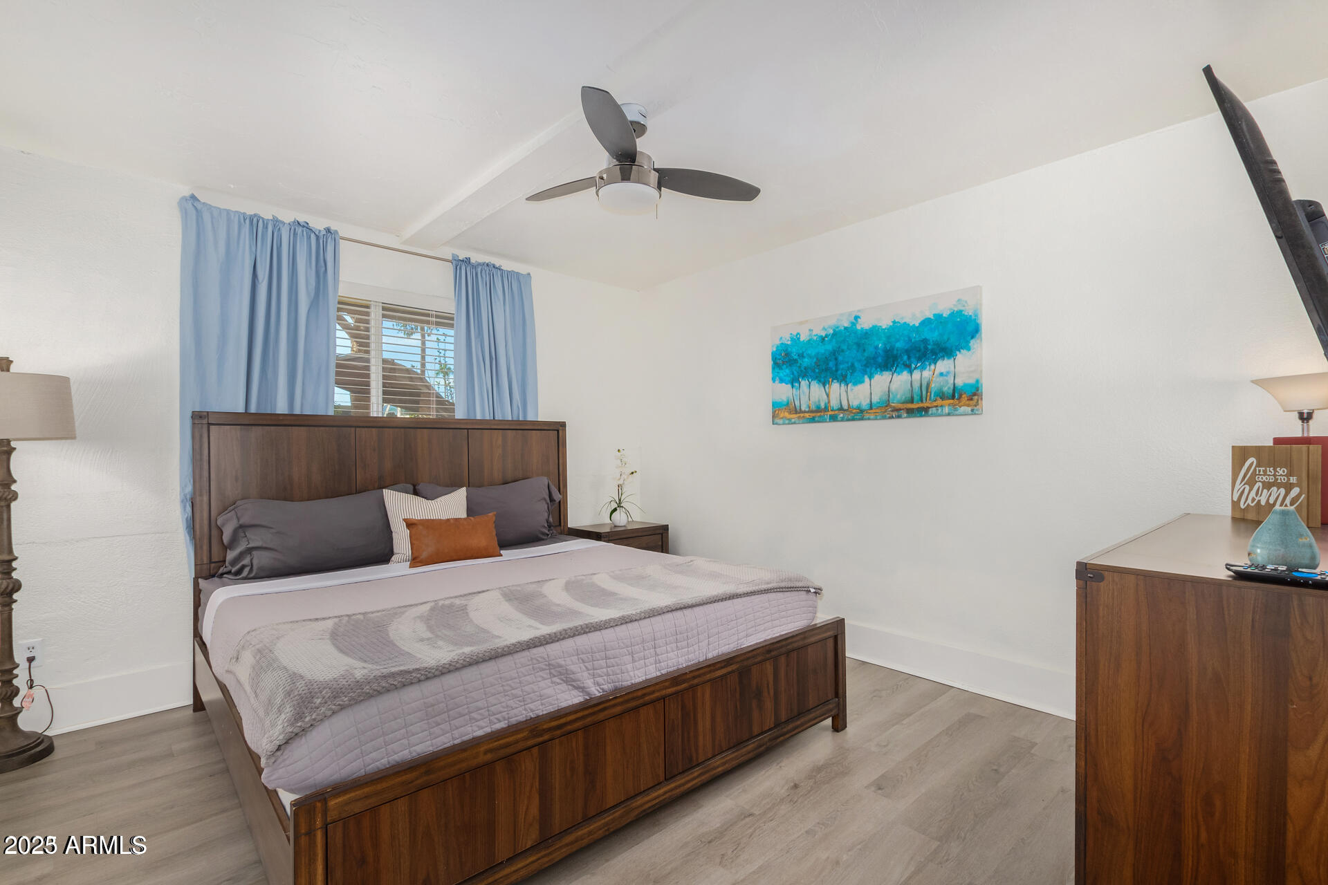 7625 East Camelback Road, Unit A133 Scottsdale, AZ 85251 - Photo 14 of 26 a bedroom with a bed and painting on the wall