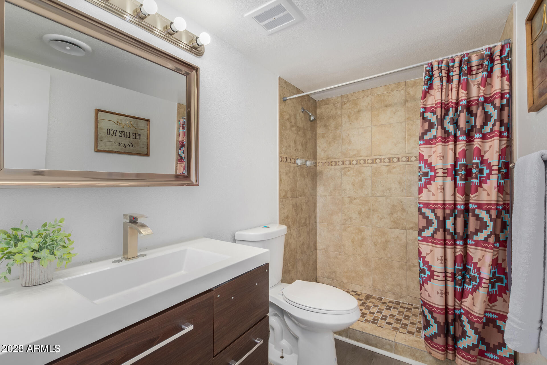 7625 East Camelback Road, Unit A133 Scottsdale, AZ 85251 - Photo 18 of 26 a bathroom with a sink toilet and shower
