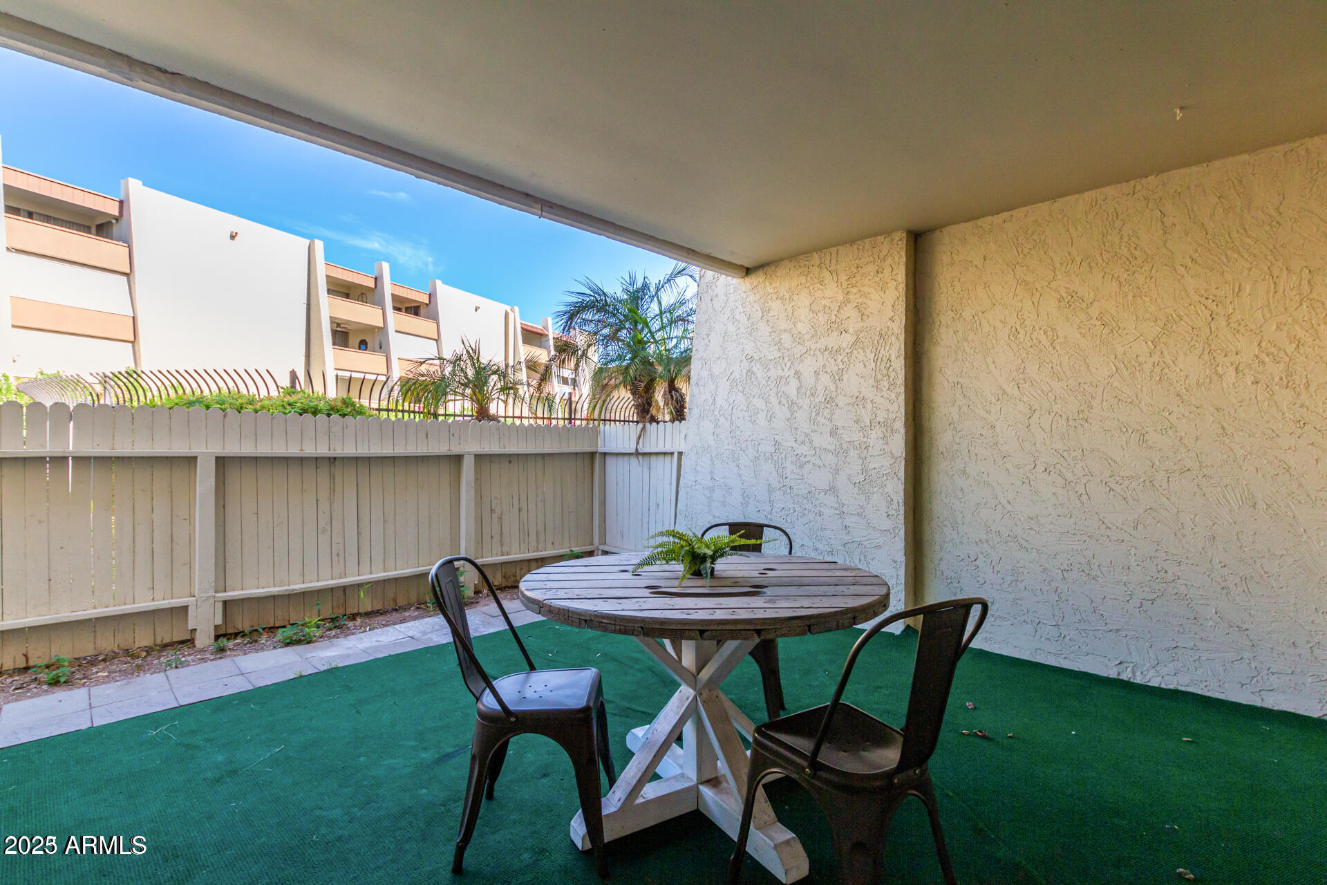7625 East Camelback Road, Unit A133 Scottsdale, AZ 85251 - Photo 20 of 26 a view of a dining room with furniture and window