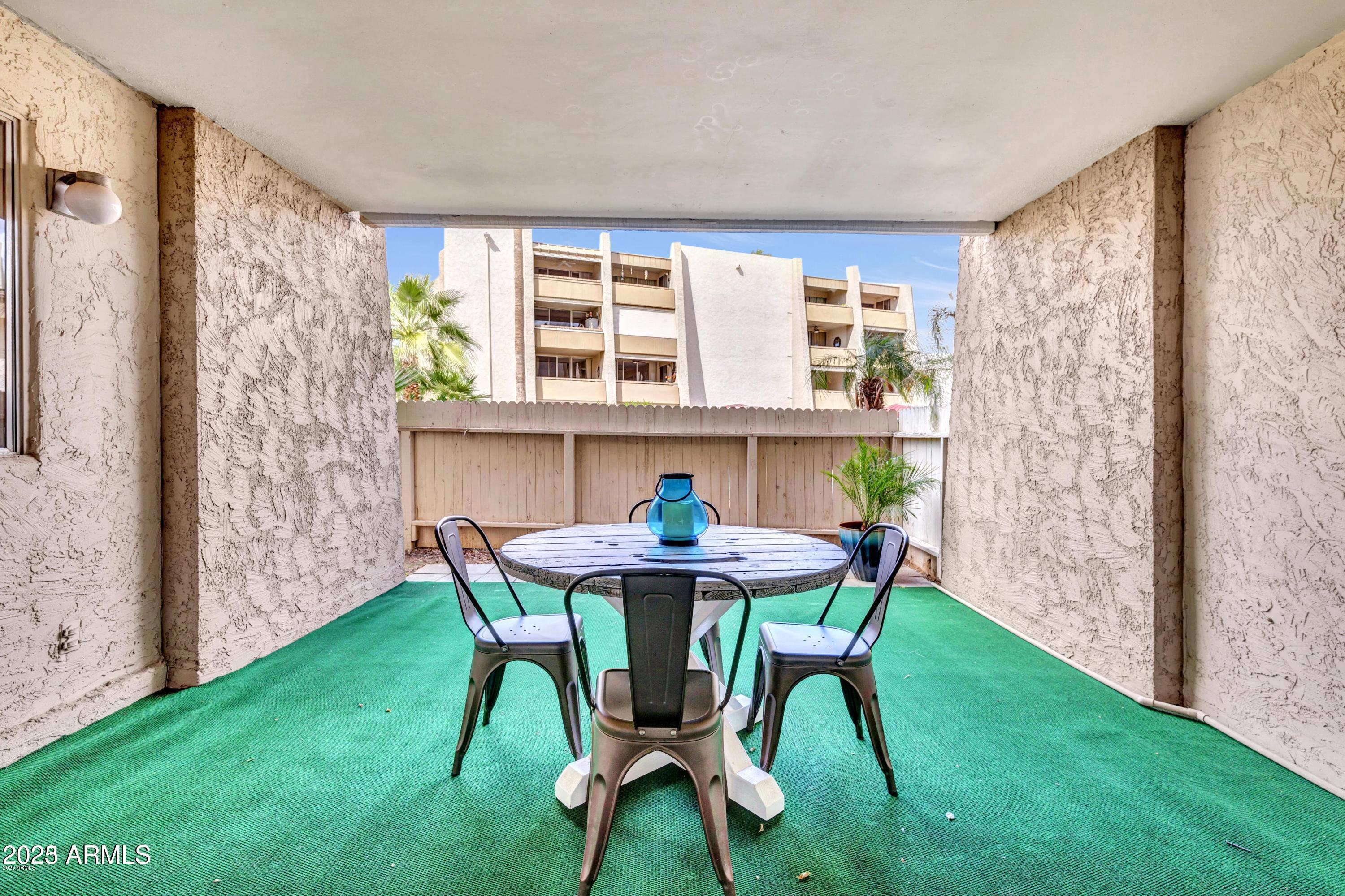 7625 East Camelback Road, Unit A133 Scottsdale, AZ 85251 - Photo 21 of 26 a view of a dining room with furniture window and outside view