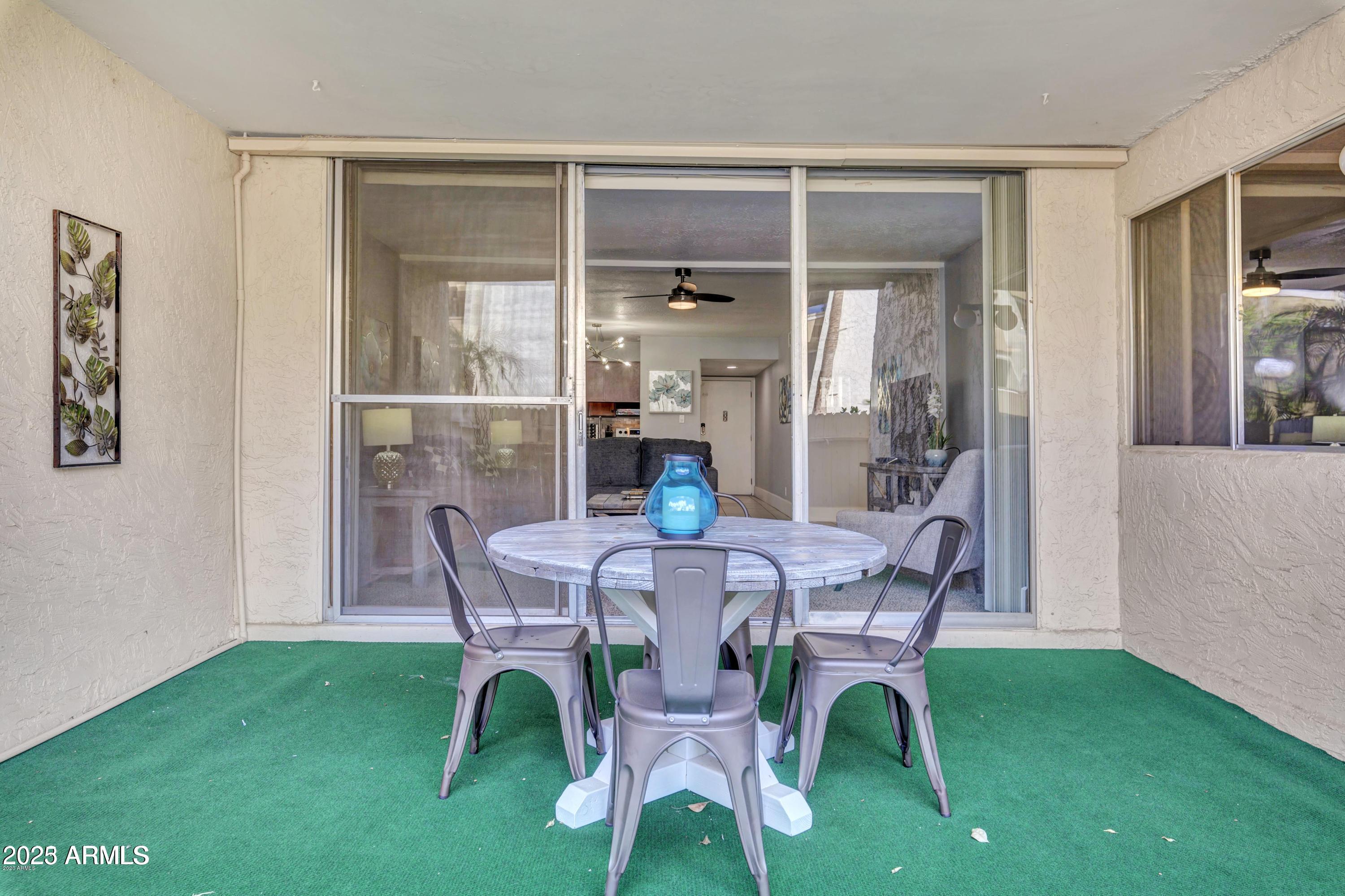7625 East Camelback Road, Unit A133 Scottsdale, AZ 85251 - Photo 22 of 26 a dining room with furniture and window