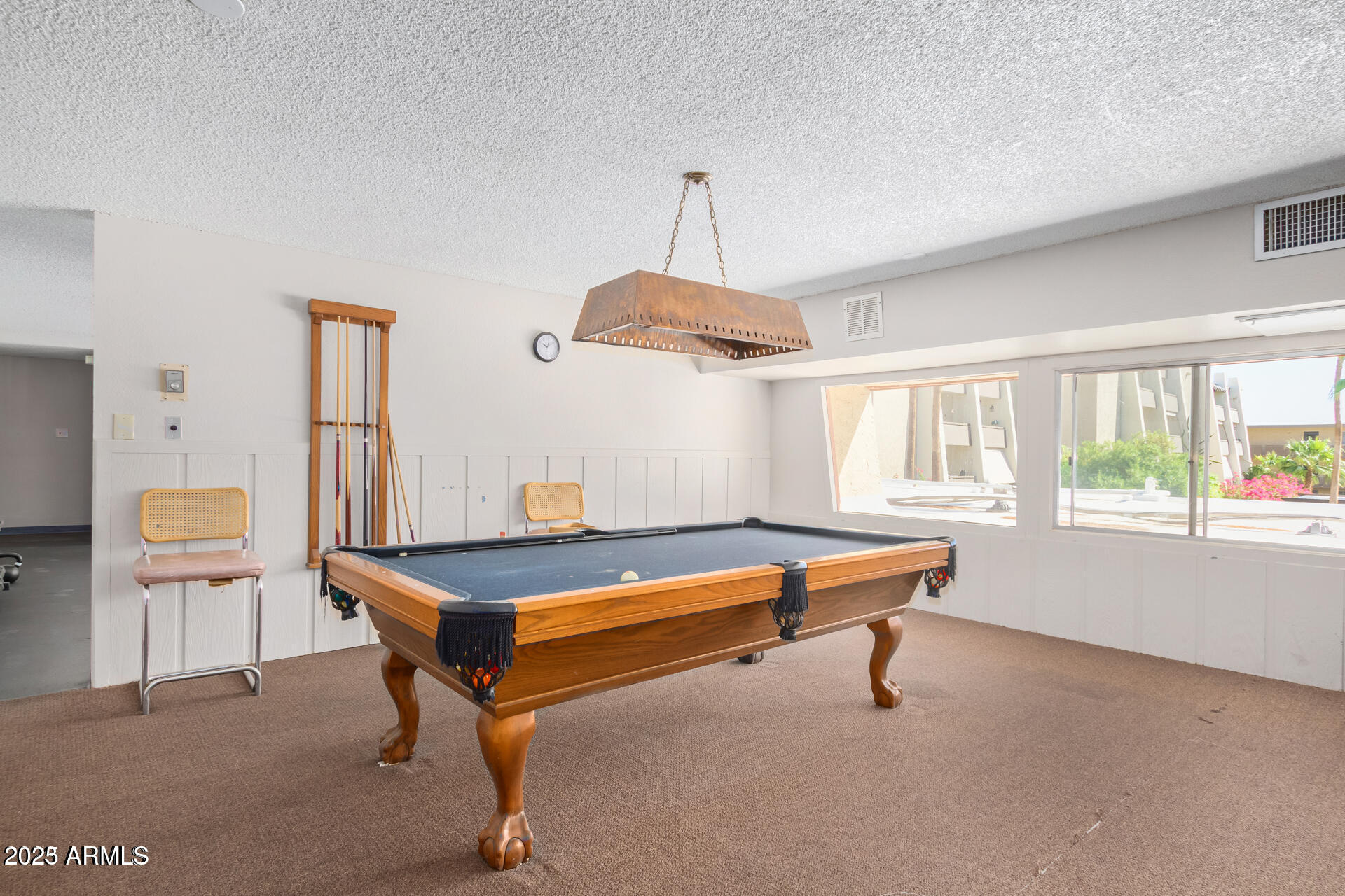 7625 East Camelback Road, Unit A133 Scottsdale, AZ 85251 - Photo 24 of 26 a room with furniture and window