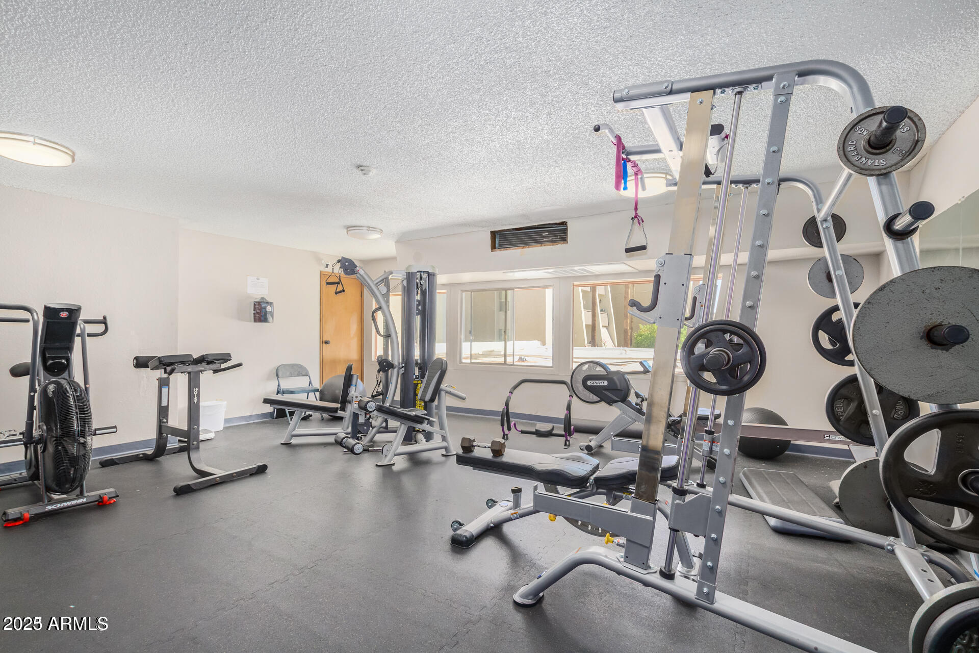 7625 East Camelback Road, Unit A133 Scottsdale, AZ 85251 - Photo 3 of 26 a view of a room with gym equipment