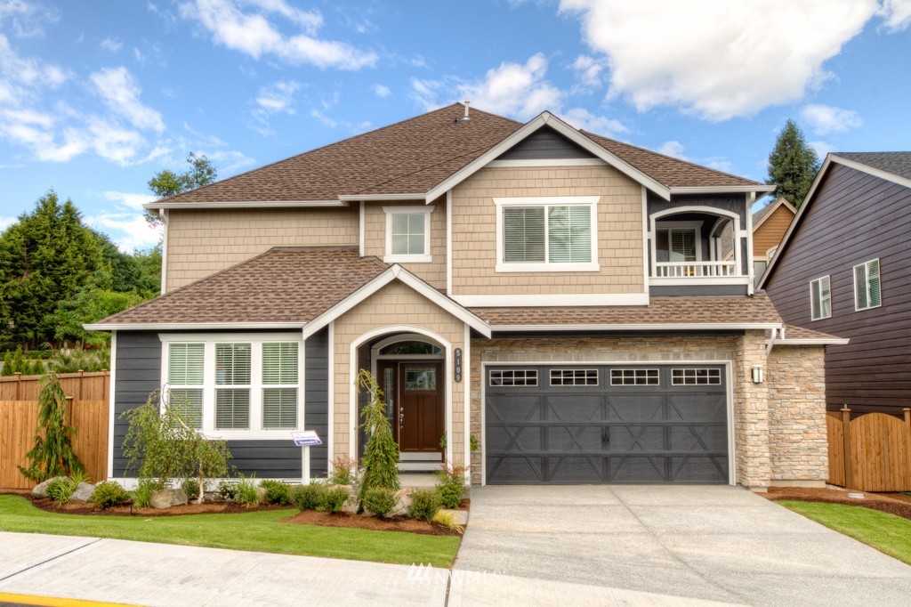 18201 41st Avenue Southeast Bothell, WA 98012 - Photo 1 of 19 a front view of a house with a yard and garage