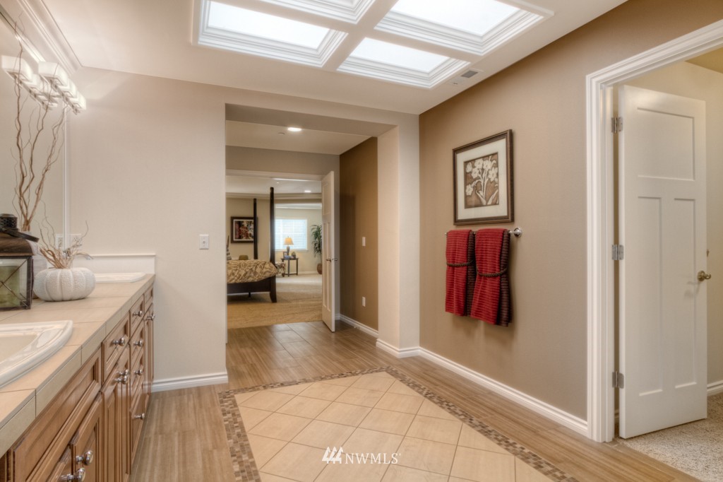 18201 41st Avenue Southeast Bothell, WA 98012 - Photo 14 of 19 a view of a hallway with wooden floor and windows