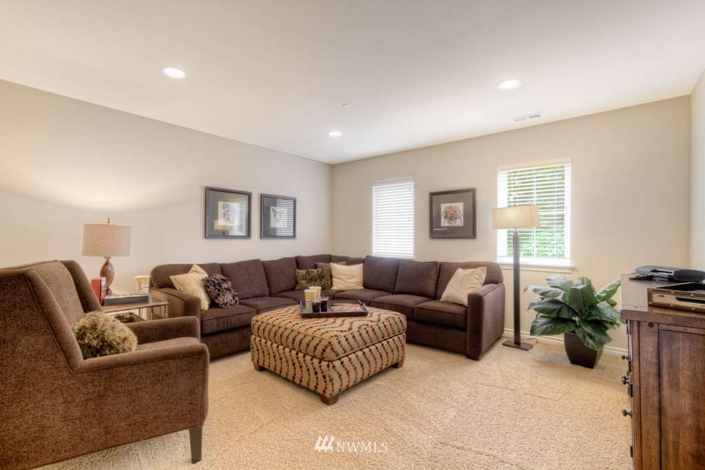 18201 41st Avenue Southeast Bothell, WA 98012 - Photo 17 of 19 a living room with furniture and a window