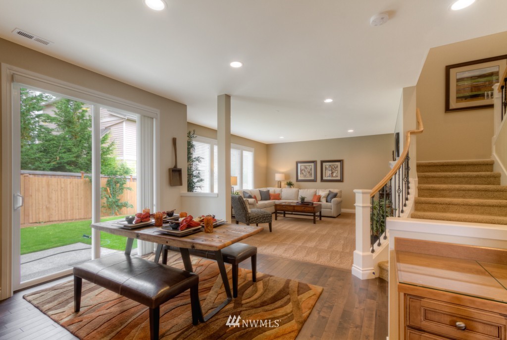 18201 41st Avenue Southeast Bothell, WA 98012 - Photo 5 of 19 a living room with furniture and a wooden floor