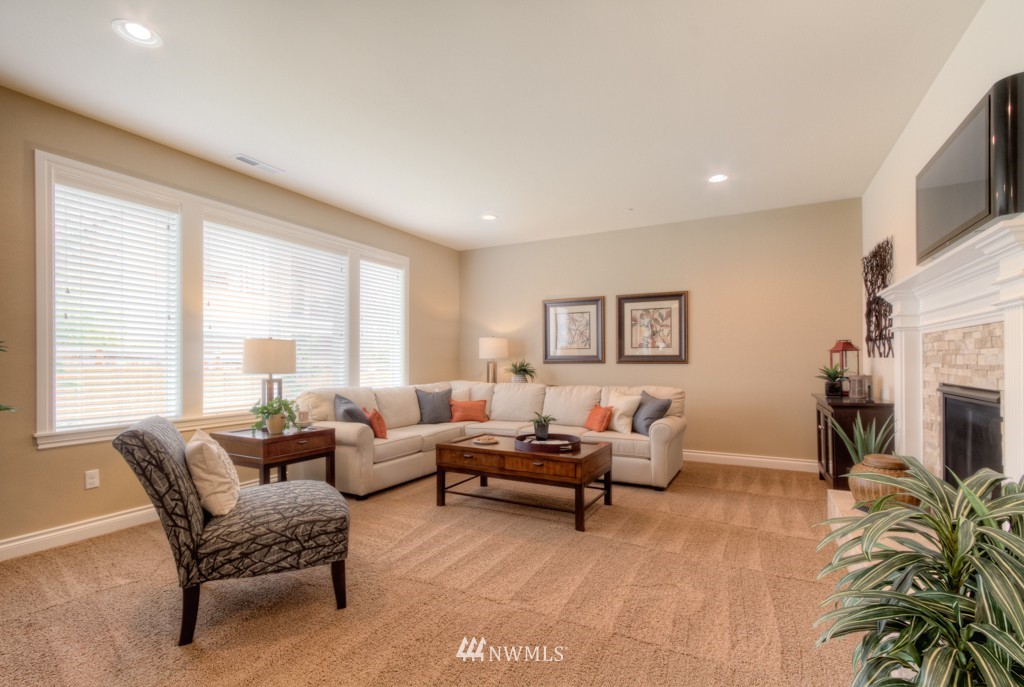 18201 41st Avenue Southeast Bothell, WA 98012 - Photo 6 of 19 a living room with furniture and a fireplace