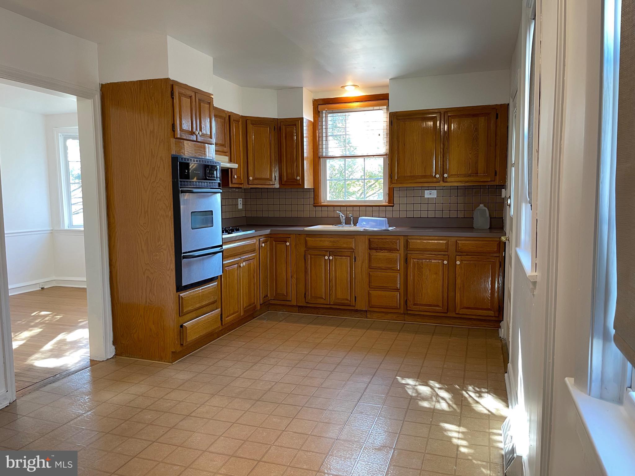 7940 Church Road Jenkintown, PA 19046 - Photo 12 of 38 a kitchen with stainless steel appliances granite countertop a refrigerator and a sink