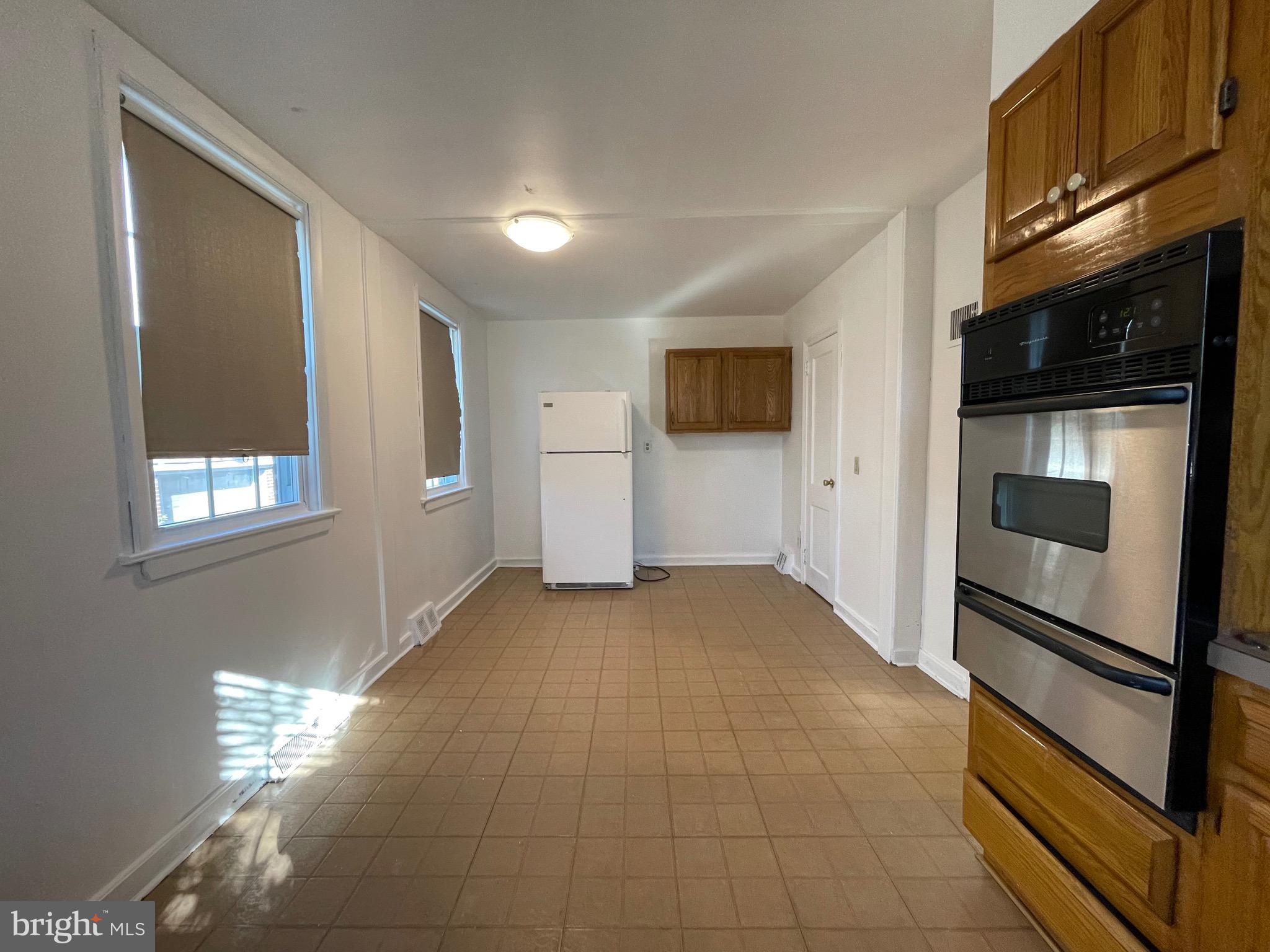 7940 Church Road Jenkintown, PA 19046 - Photo 14 of 38 a view of hallway with window and wooden floor