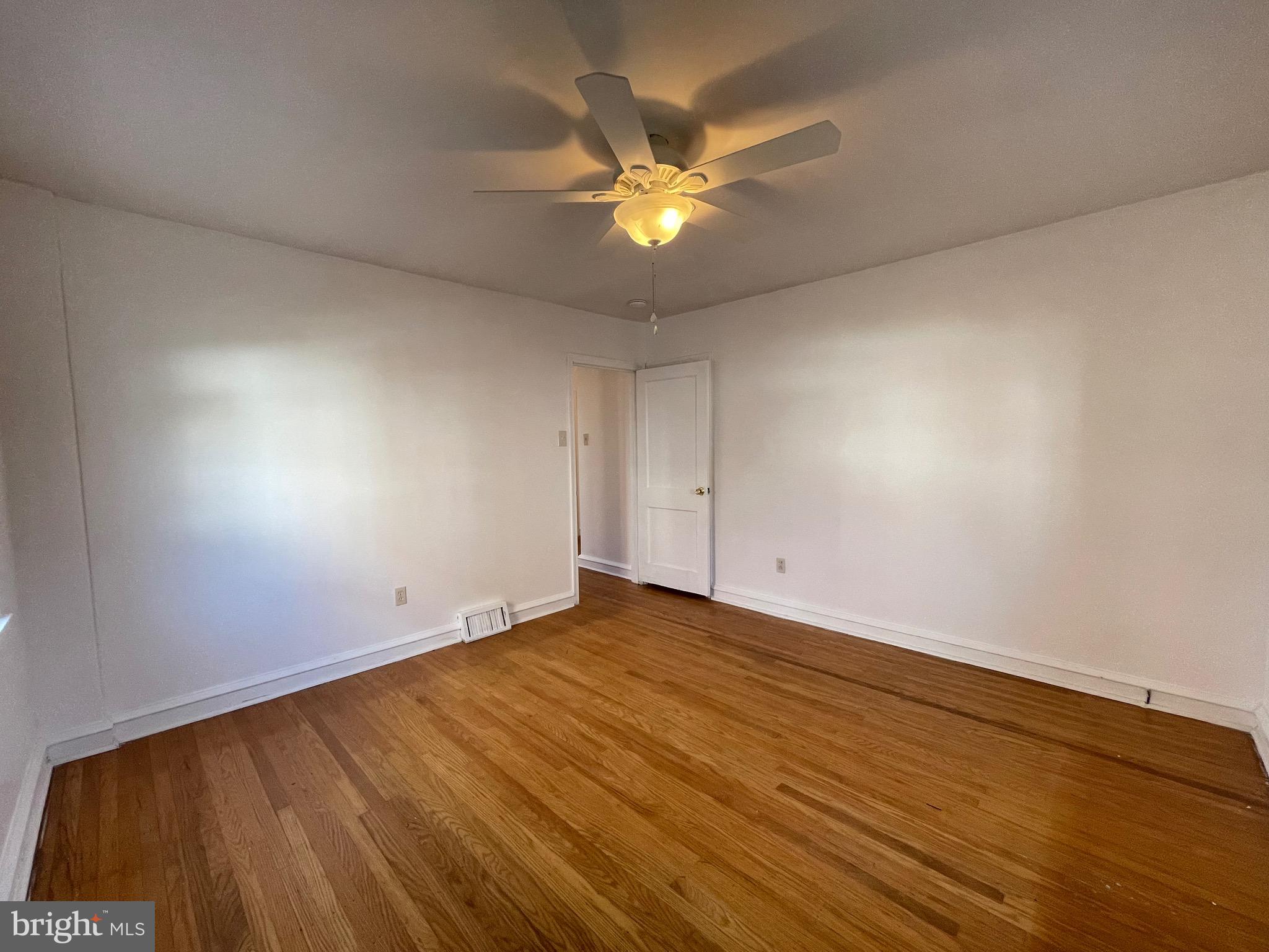 7940 Church Road Jenkintown, PA 19046 - Photo 22 of 38 a view of an empty room with window and wooden floor
