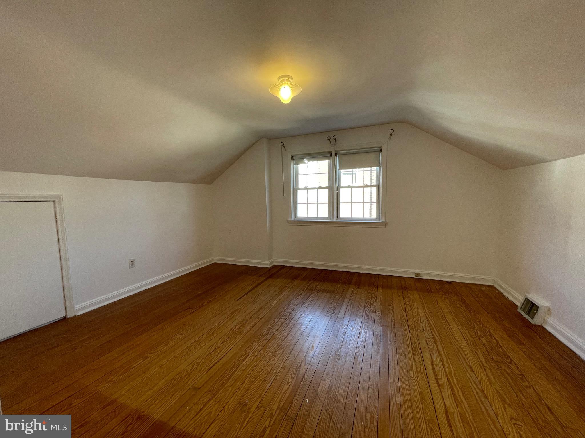 7940 Church Road Jenkintown, PA 19046 - Photo 23 of 38 an empty room with wooden floor and windows