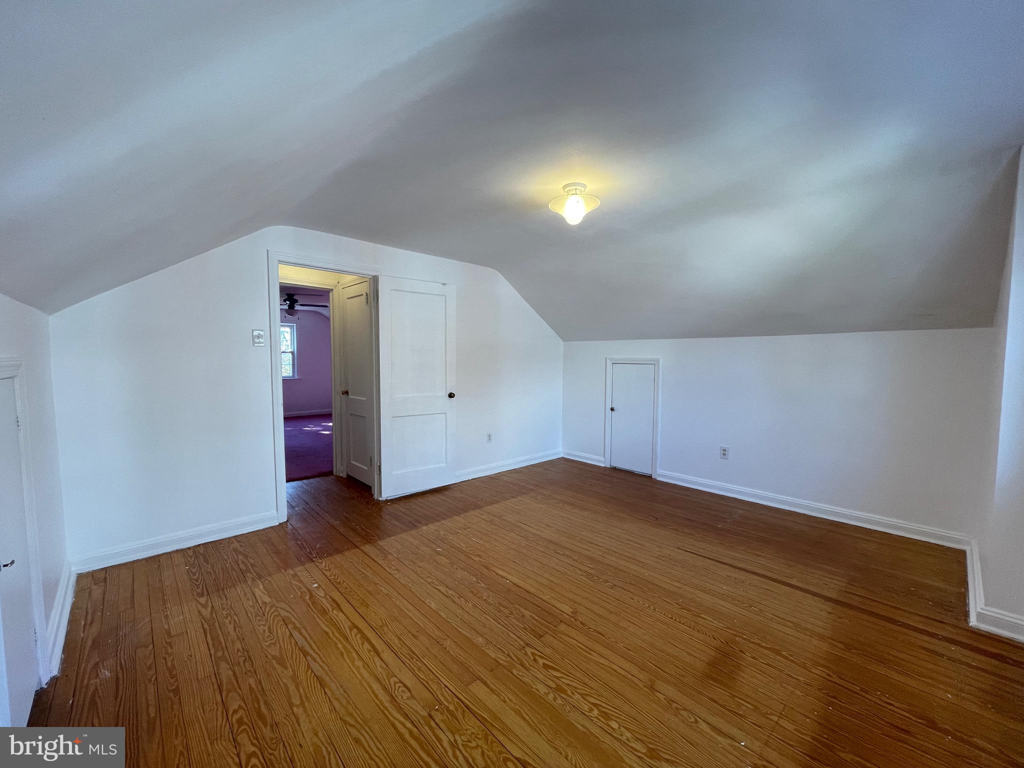 7940 Church Road Jenkintown, PA 19046 - Photo 24 of 38 an empty room with wooden floor and windows