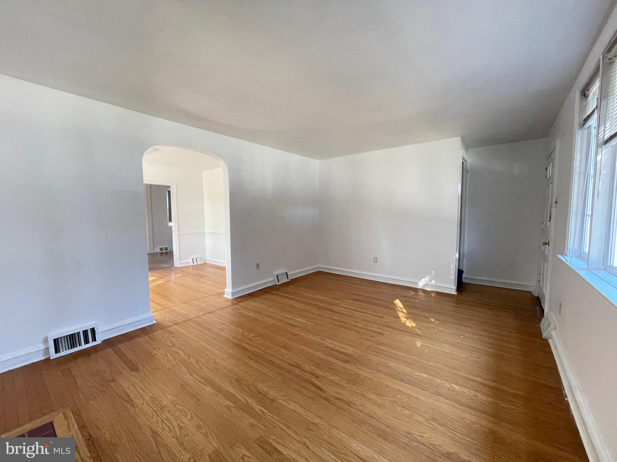 7940 Church Road Jenkintown, PA 19046 - Photo 5 of 38 an empty room with wooden floor and windows