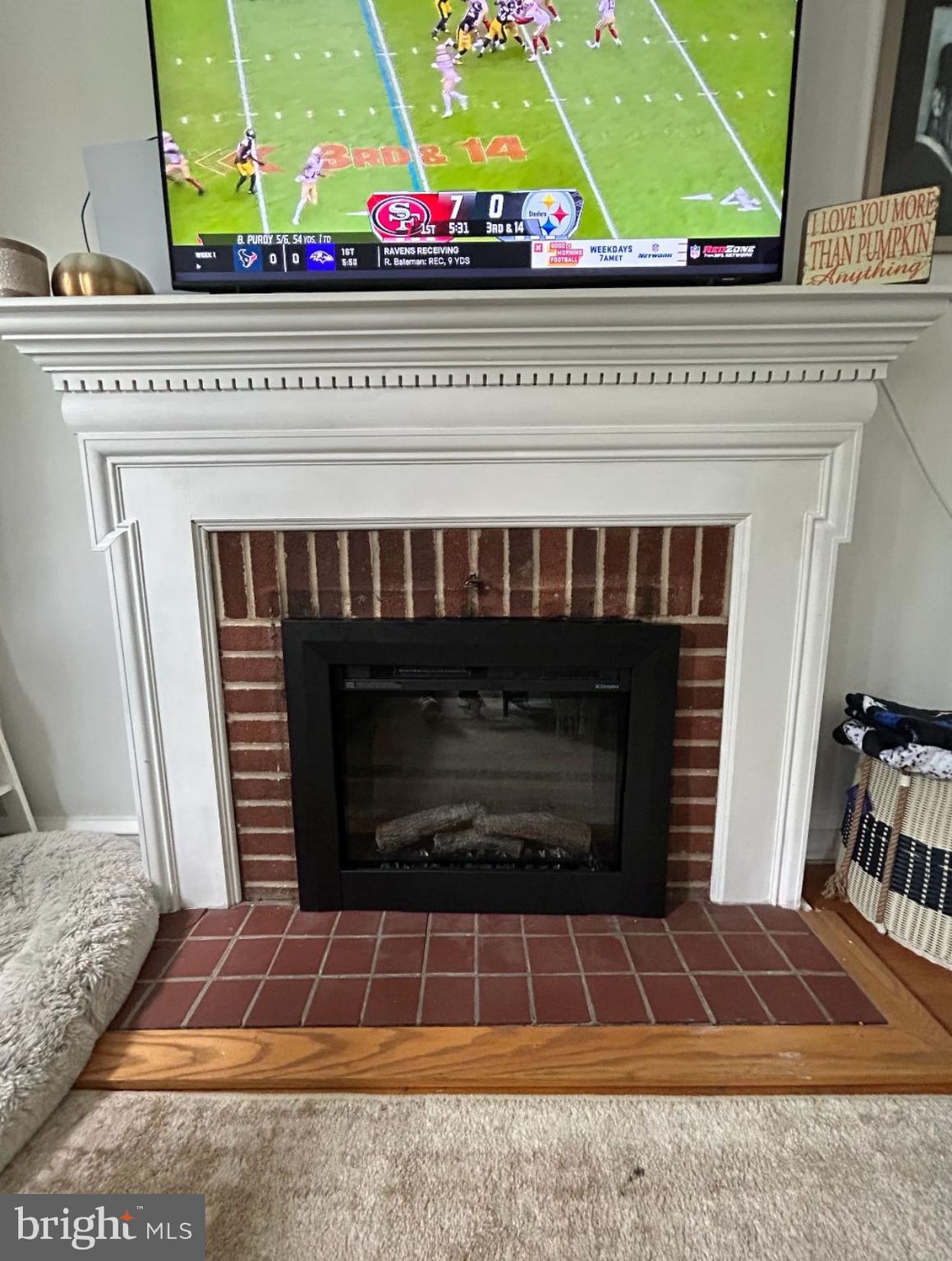 7940 Church Road Jenkintown, PA 19046 - Photo 7 of 38 a living room with a fireplace and a rug