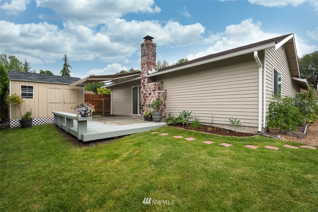 1326 232nd Place Southwest Bothell, WA 98021 - Photo 19 of 23 a front view of a house with garden