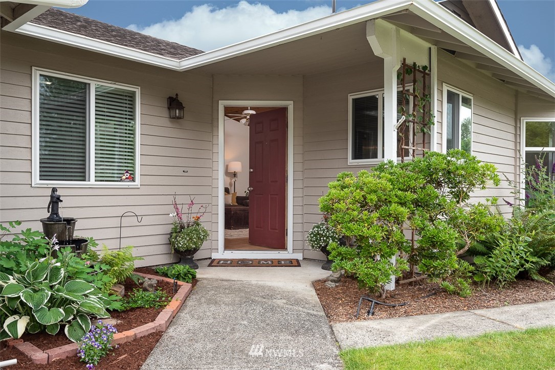1326 232nd Place Southwest Bothell, WA 98021 - Photo 3 of 23 a front view of a house with garden