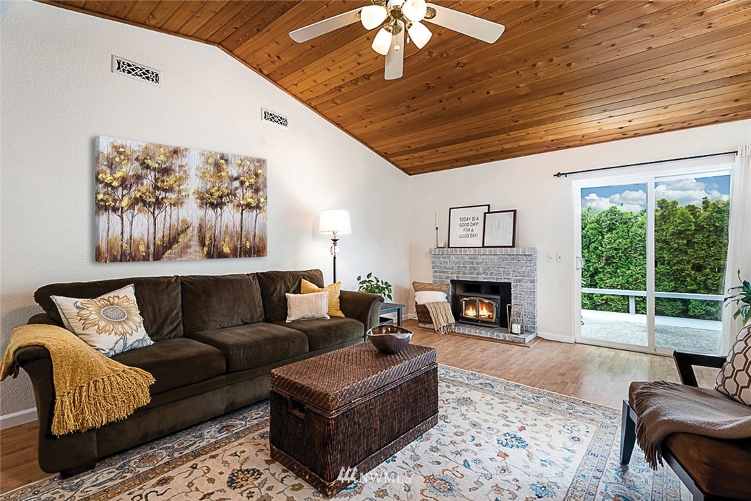 1326 232nd Place Southwest Bothell, WA 98021 - Photo 5 of 23 a living room with furniture and a fireplace