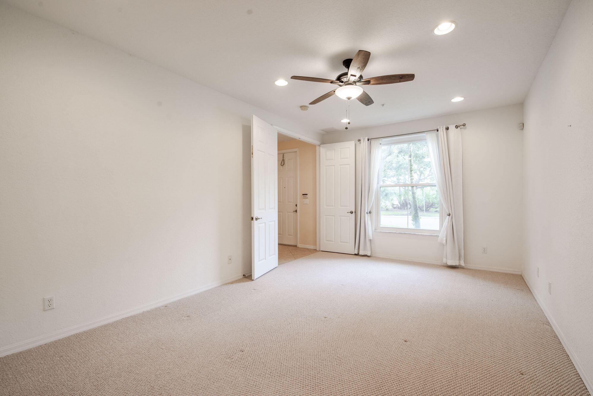 1484 Frederick Small Road Jupiter, FL 33458 - Photo 11 of 19 a view of an empty room with a window