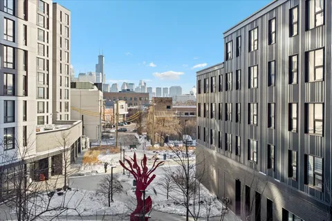 a view of living room with furniture and a fireplace