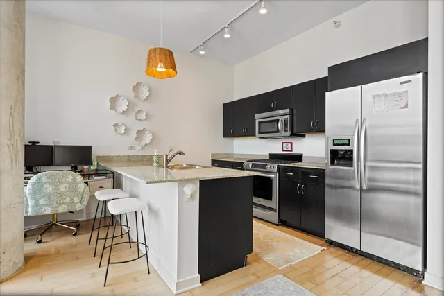 a living room with a large window and furniture