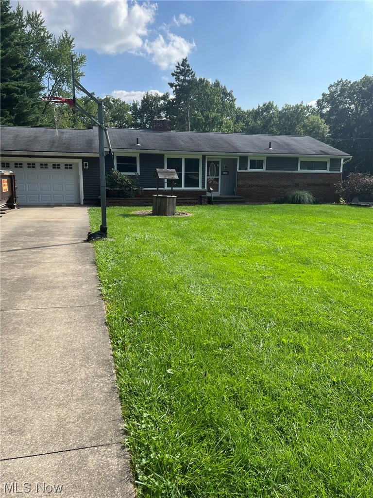 294 Lester Road New Franklin, OH 44319 - Photo 13 of 24 Single story home featuring garage and a front lawn