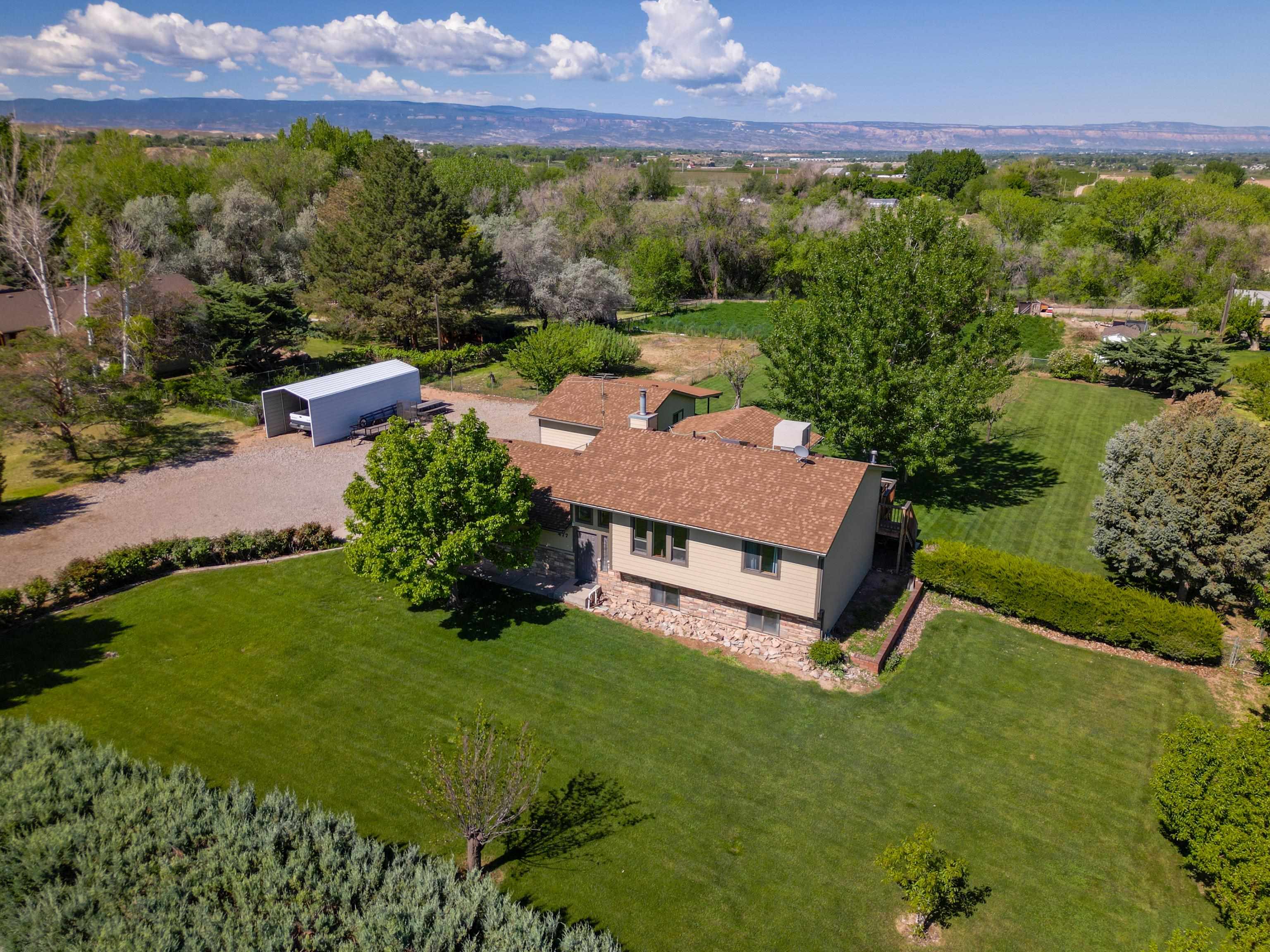an aerial view of a house with a garden