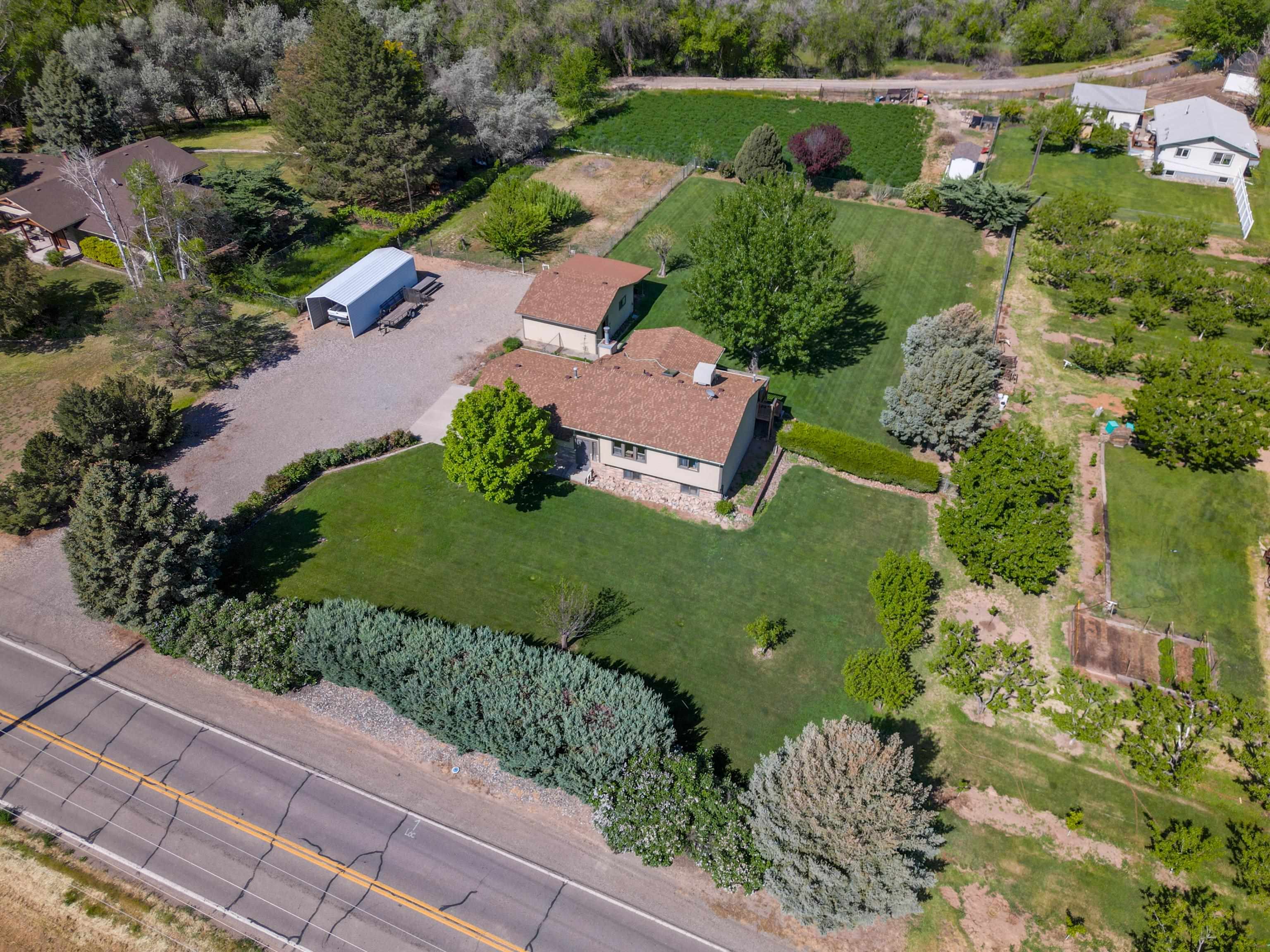 477 35 Road Palisade, CO 81526 - Photo 2 of 32 an aerial view of a house with outdoor space