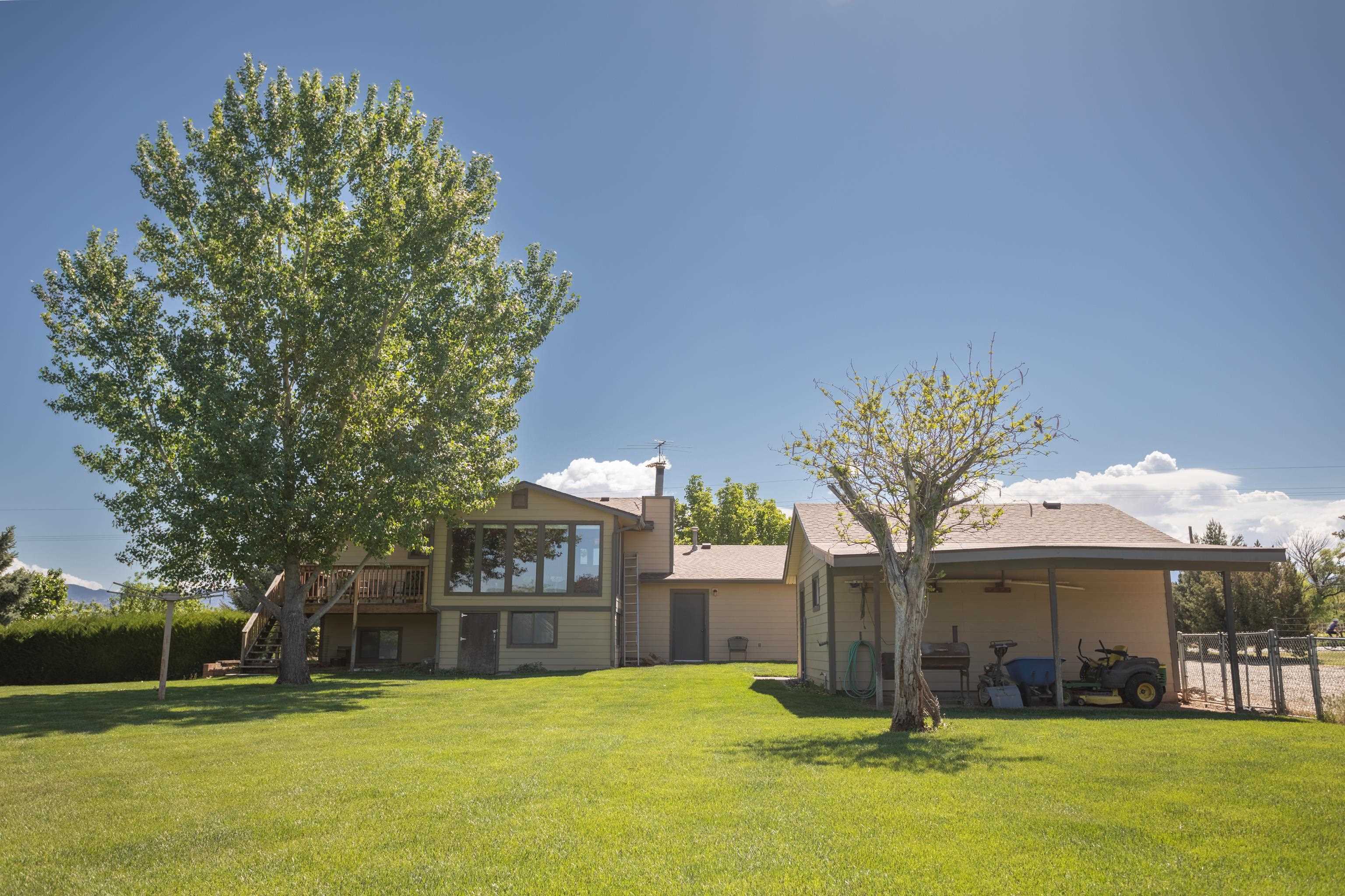 477 35 Road Palisade, CO 81526 - Photo 23 of 32 a view of a house with a yard