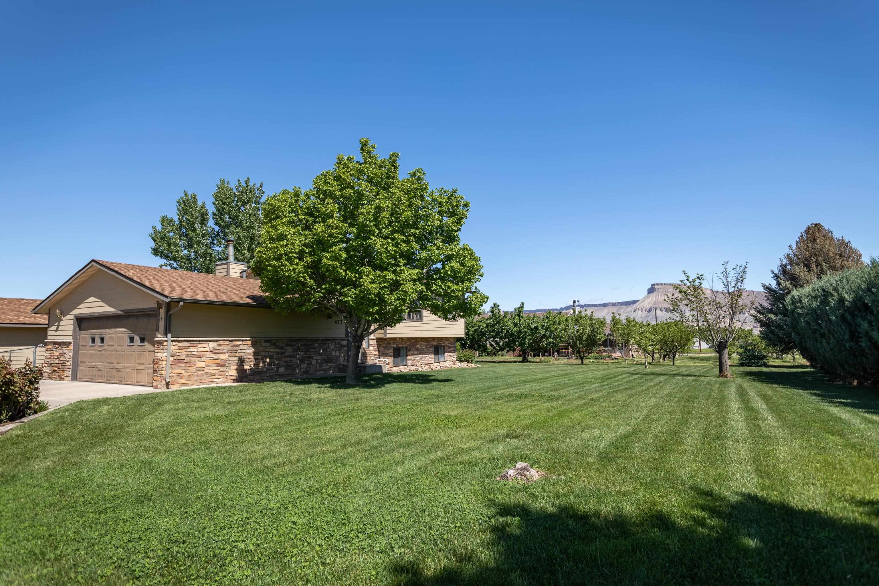 477 35 Road Palisade, CO 81526 - Photo 26 of 32 a front view of a house with garden