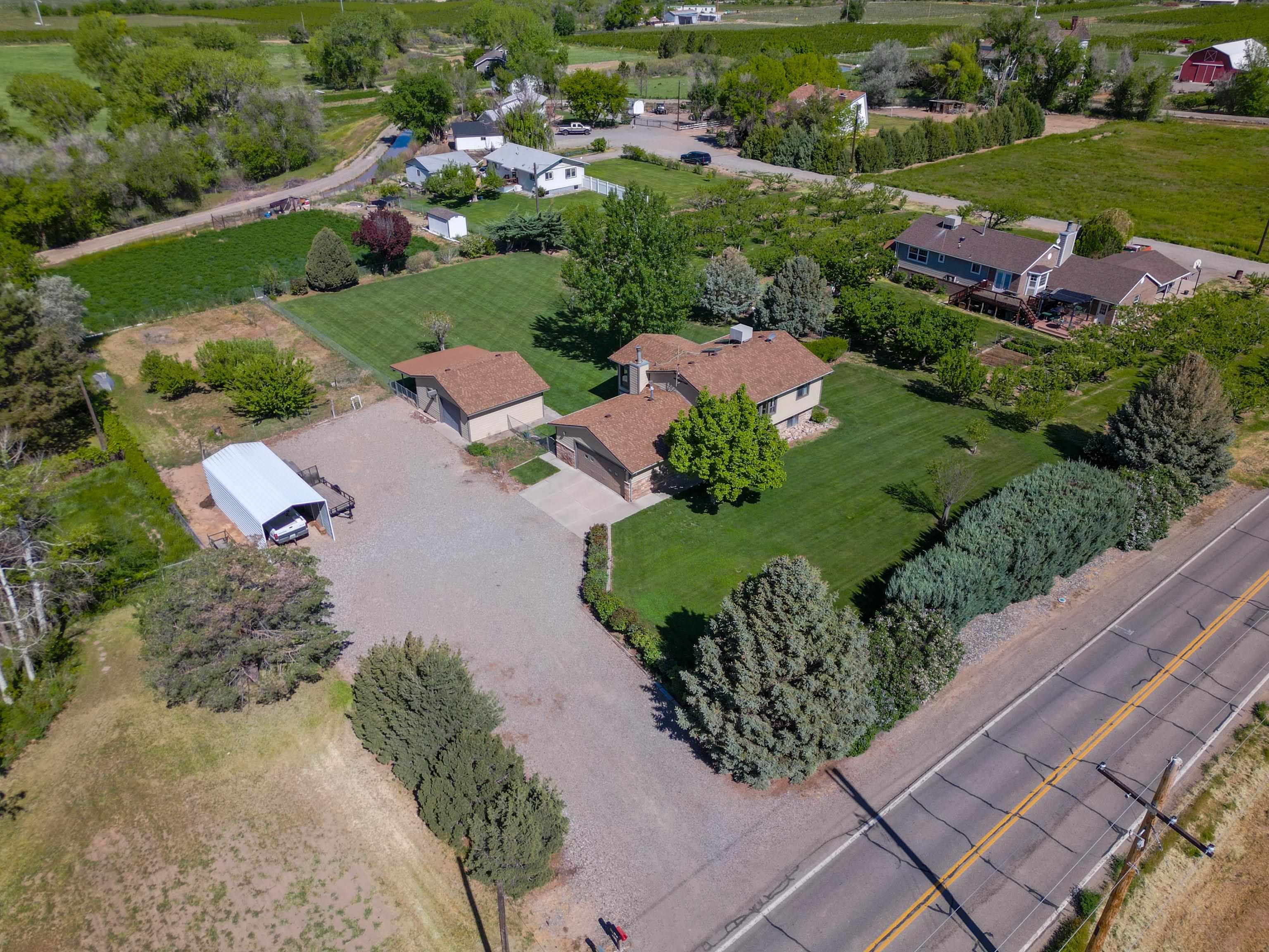 477 35 Road Palisade, CO 81526 - Photo 27 of 32 an aerial view of a house with garden space and street view