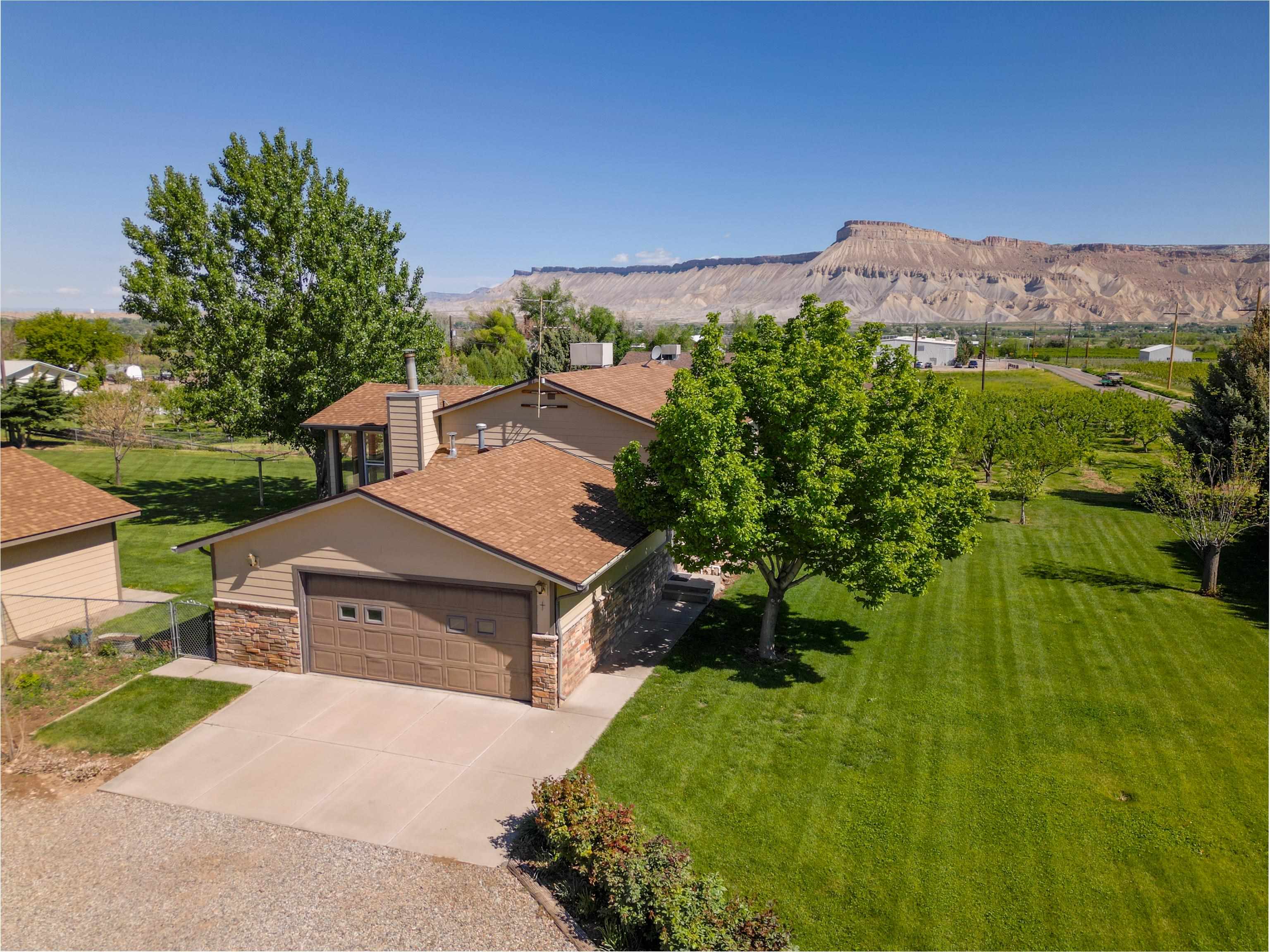 477 35 Road Palisade, CO 81526 - Photo 3 of 32 an aerial view of a house with a garden