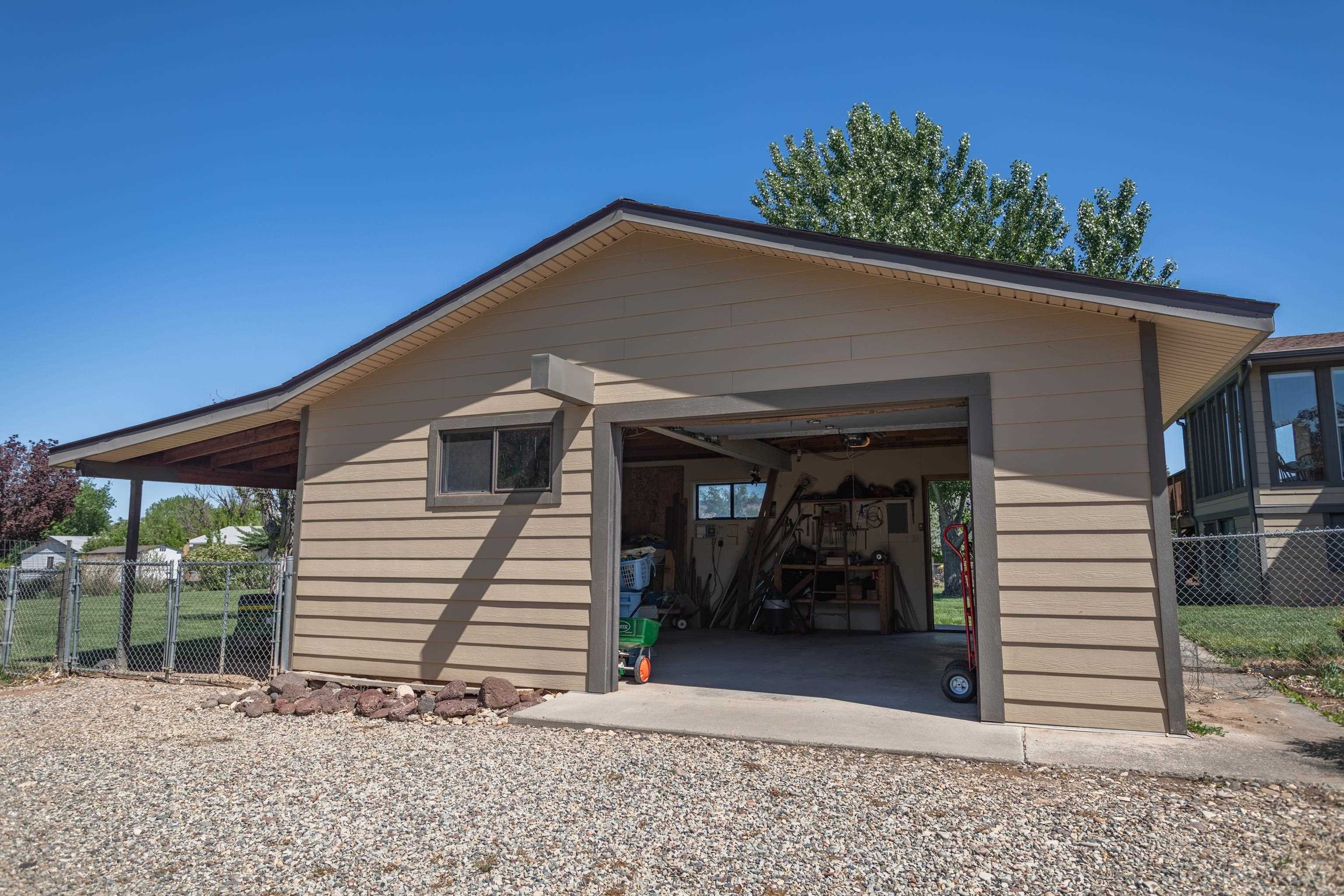 477 35 Road Palisade, CO 81526 - Photo 5 of 32 a house with trees in front of it