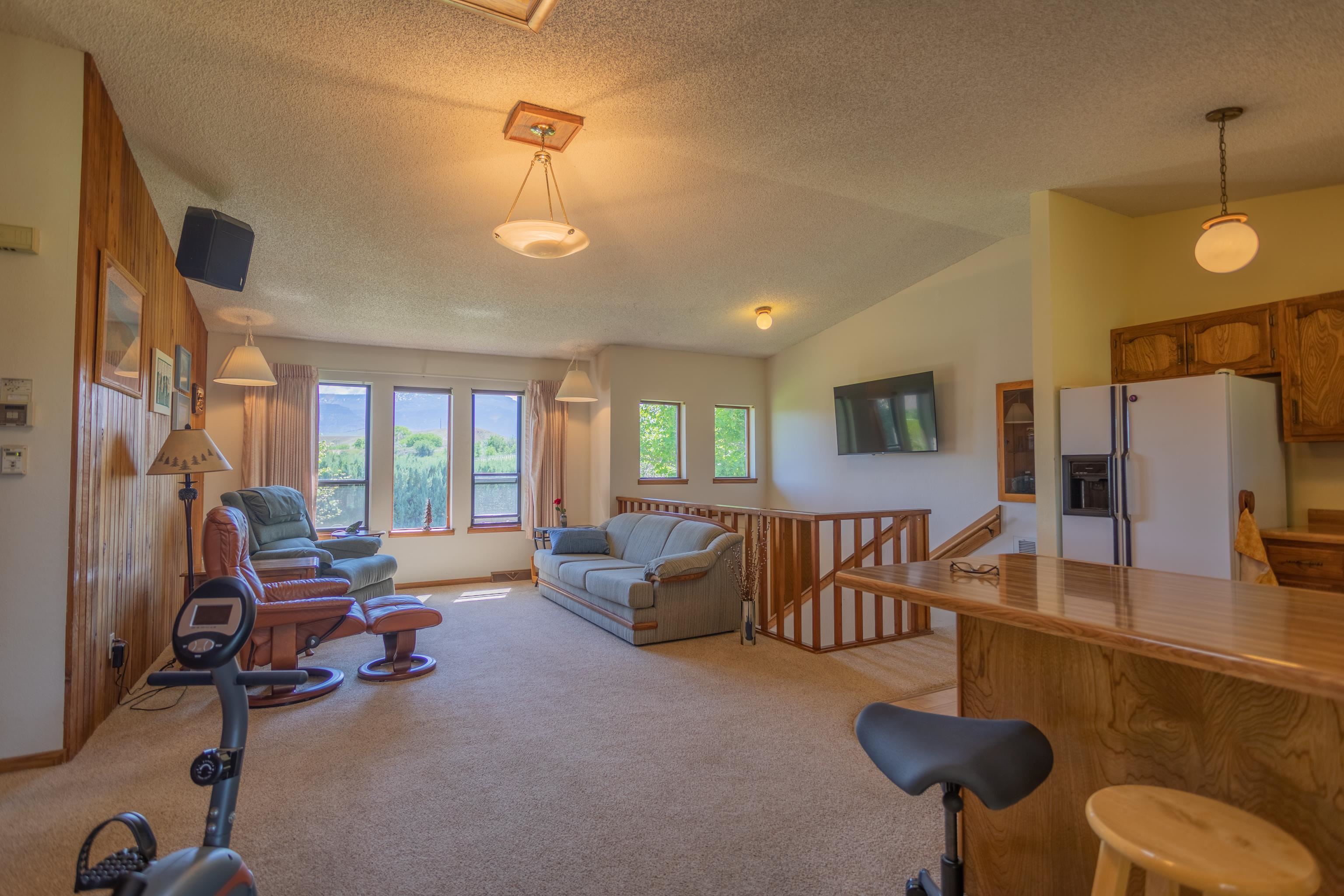 477 35 Road Palisade, CO 81526 - Photo 6 of 32 a view of a livingroom with furniture and a large window