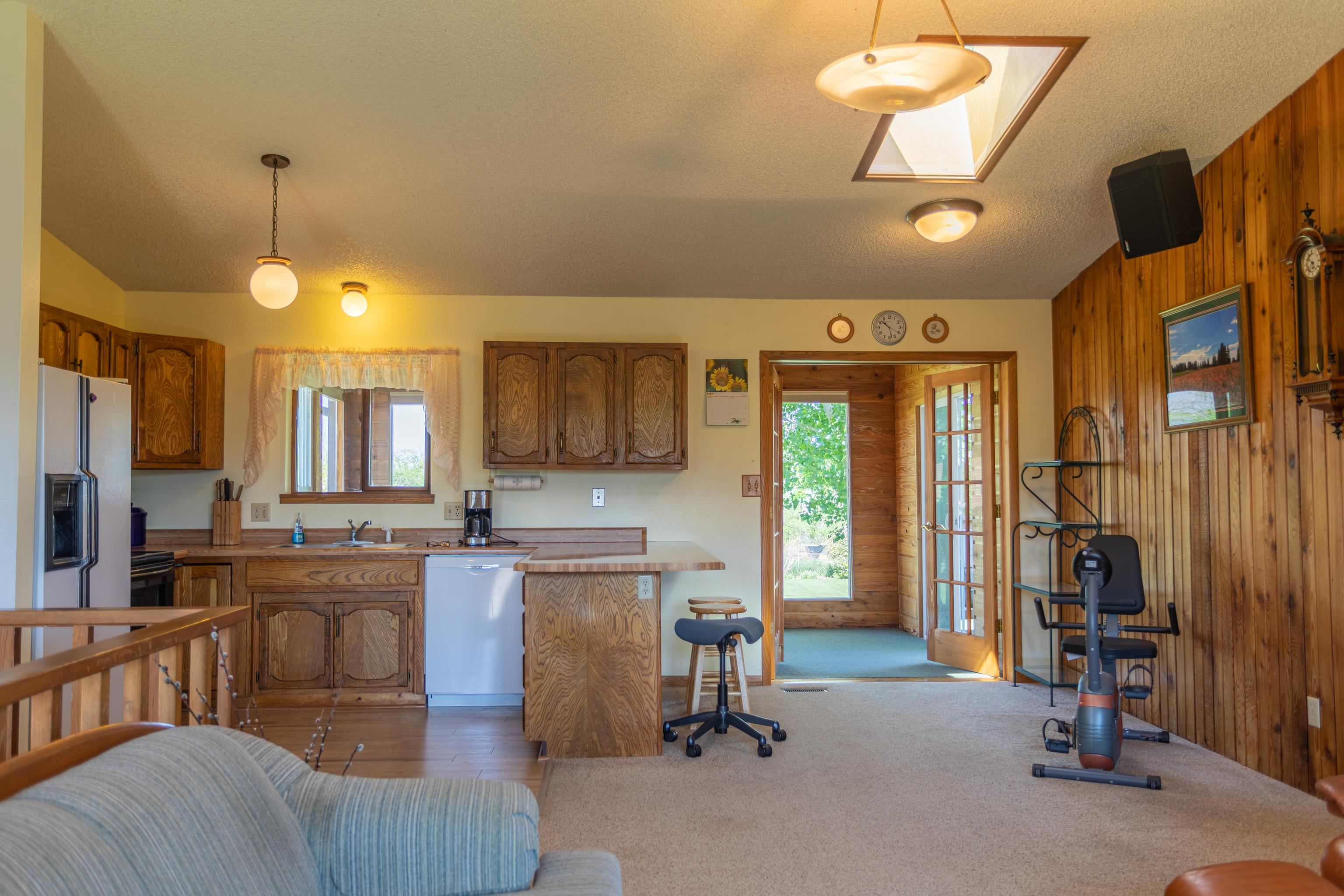 477 35 Road Palisade, CO 81526 - Photo 9 of 32 a open kitchen with stainless steel appliances granite countertop a stove and a refrigerator