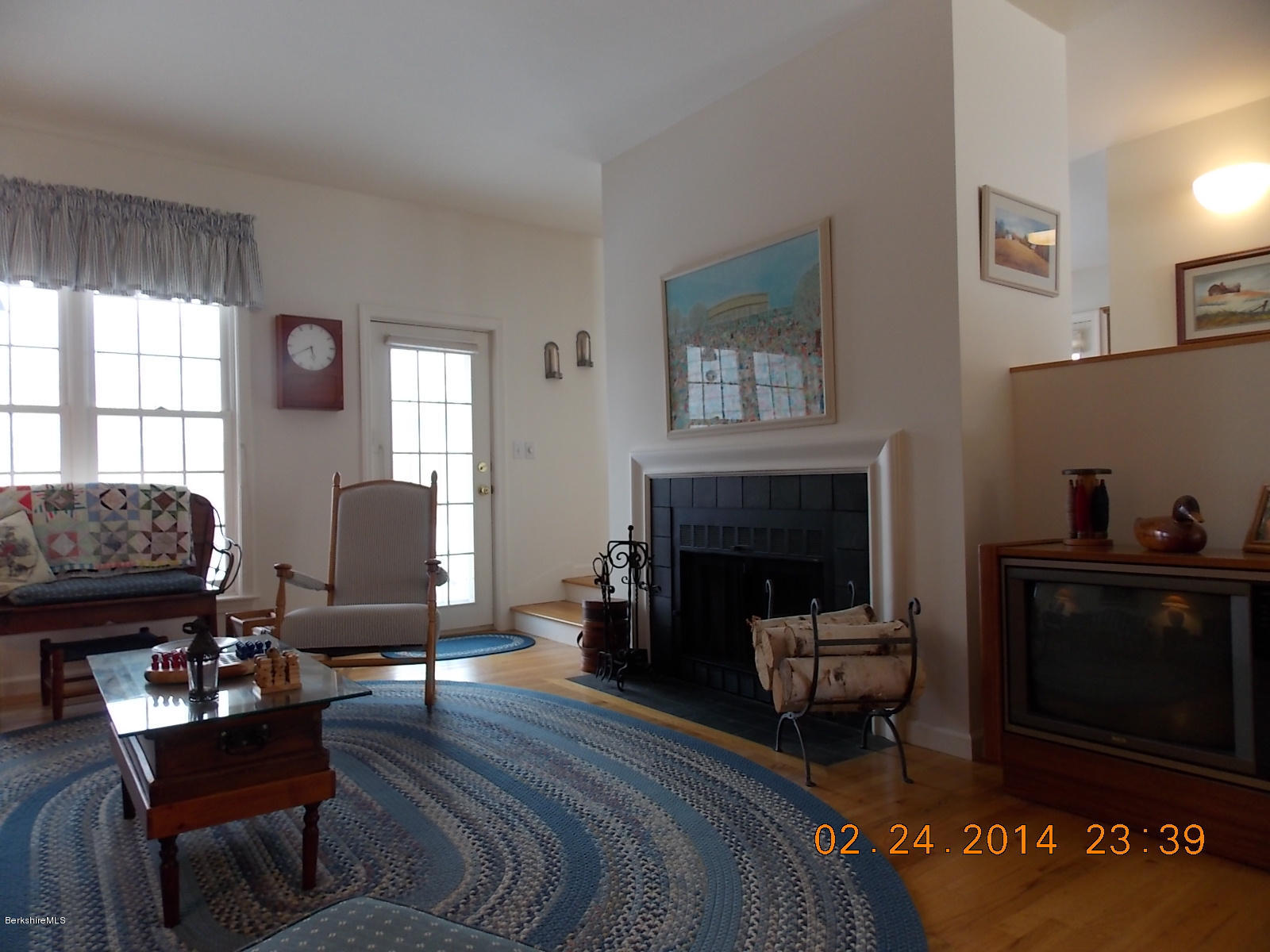 1136-9 Barker Road, Unit 9 Pittsfield, MA 01201 - Photo 2 of 45 a living room with furniture and a fireplace