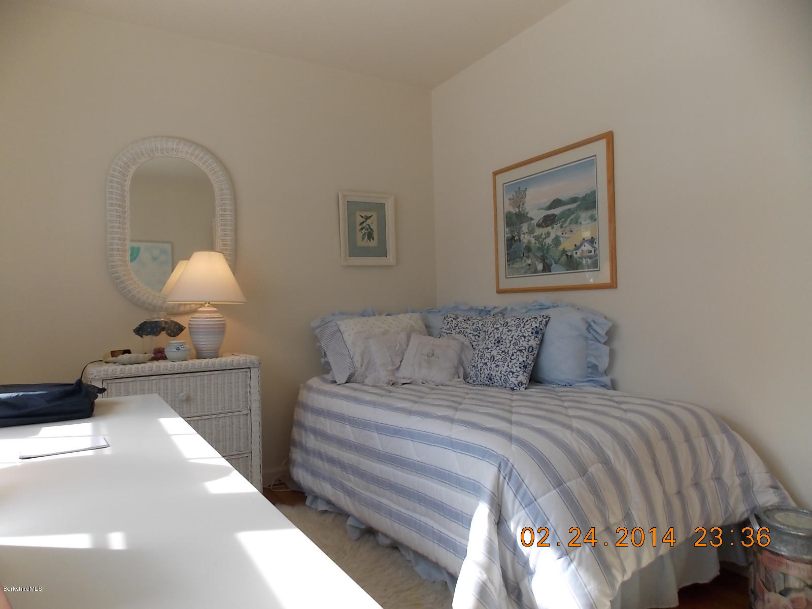 1136-9 Barker Road, Unit 9 Pittsfield, MA 01201 - Photo 12 of 45 a bedroom with a bed and a lamp