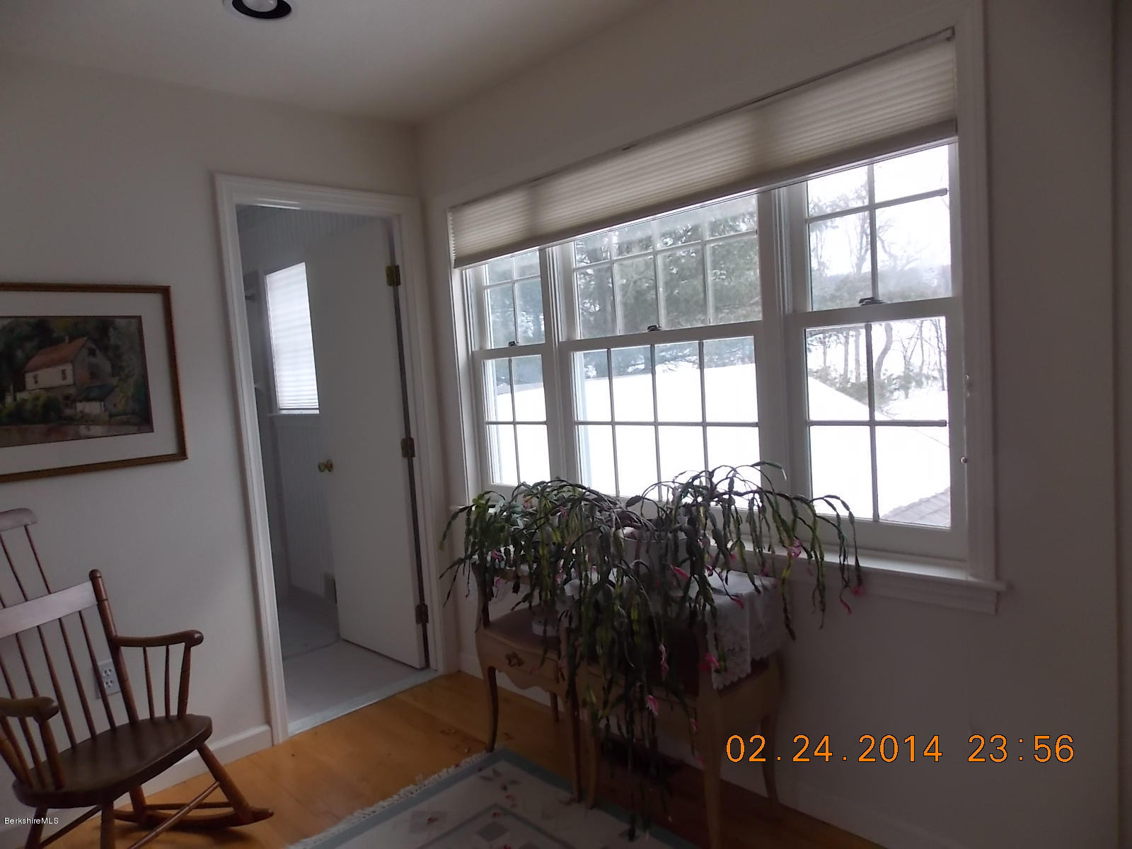 1136-9 Barker Road, Unit 9 Pittsfield, MA 01201 - Photo 21 of 45 a bed sitting in a bedroom next to a window