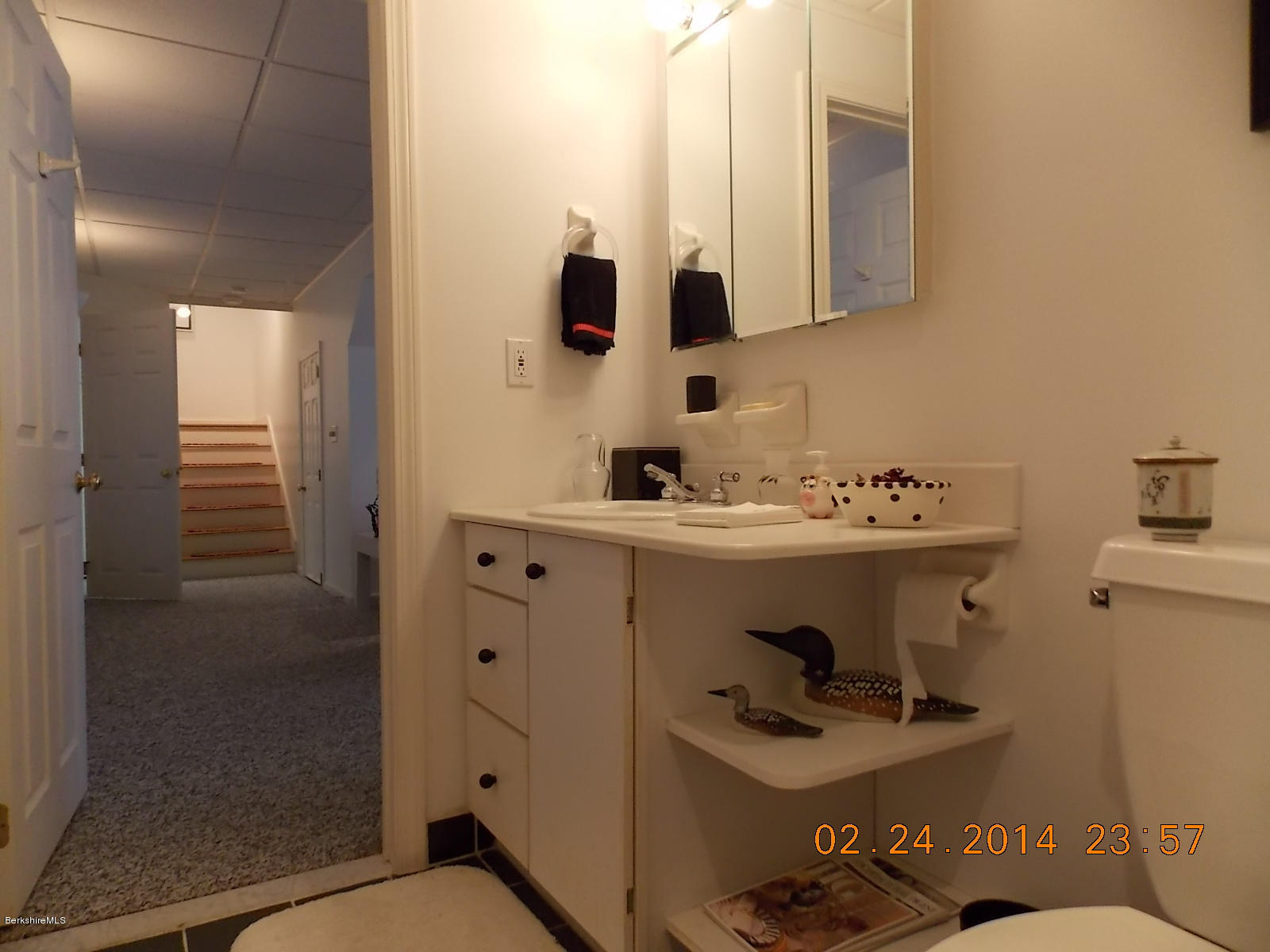 1136-9 Barker Road, Unit 9 Pittsfield, MA 01201 - Photo 22 of 45 a bathroom with a sink and a mirror