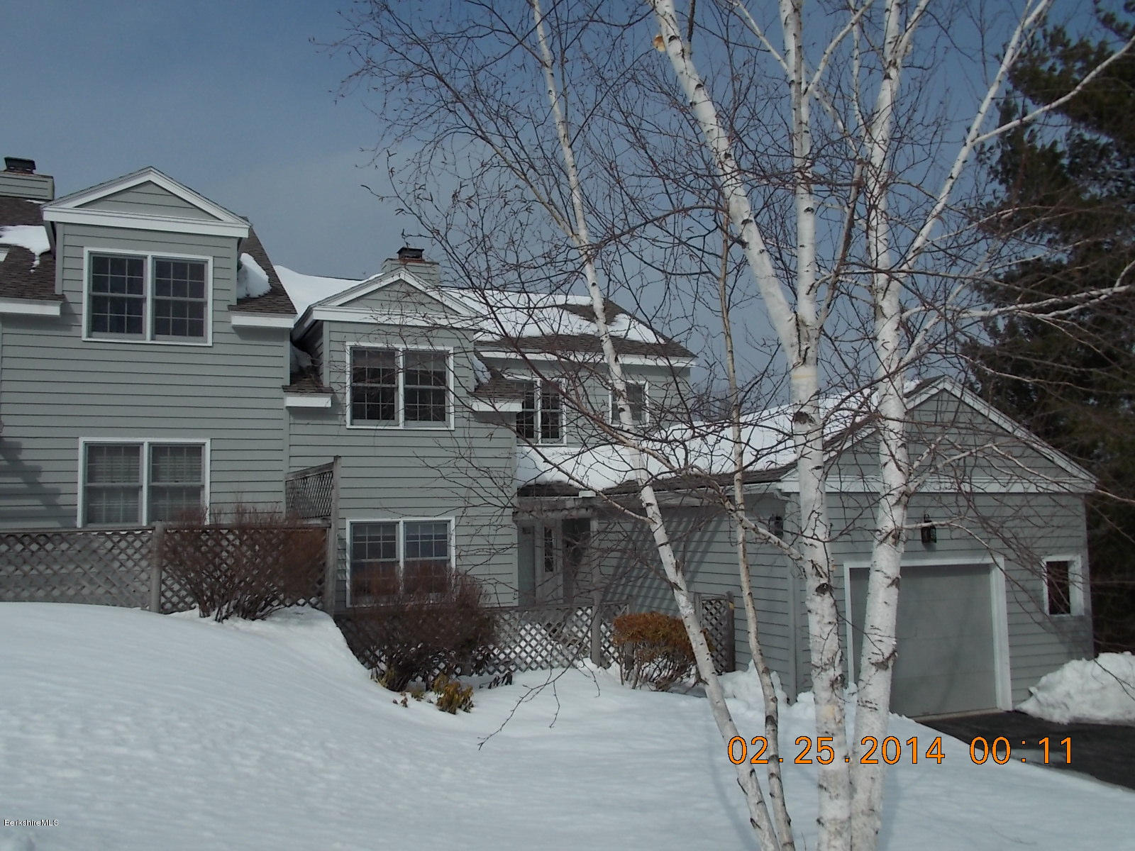 1136-9 Barker Road, Unit 9 Pittsfield, MA 01201 - Photo 29 of 45 a front view of a house with parking space