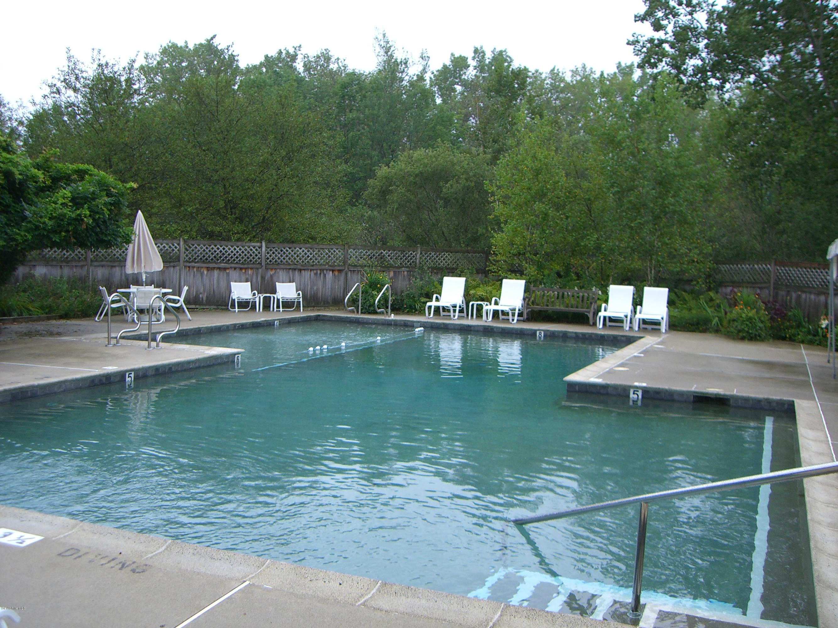 1136-9 Barker Road, Unit 9 Pittsfield, MA 01201 - Photo 37 of 45 a view of a lake with a house