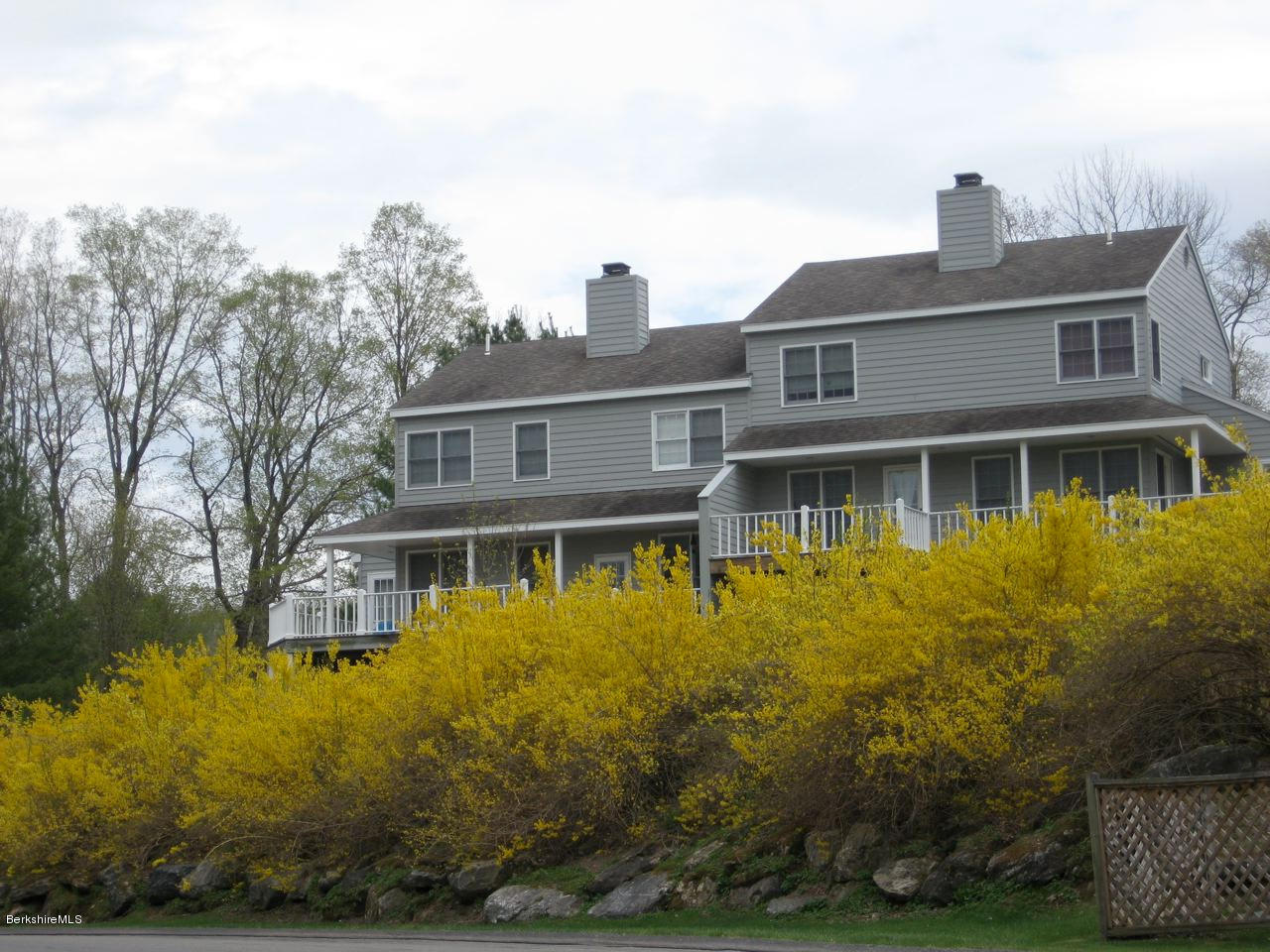 1136-9 Barker Road, Unit 9 Pittsfield, MA 01201 - Photo 42 of 45 a front view of a house with a yard