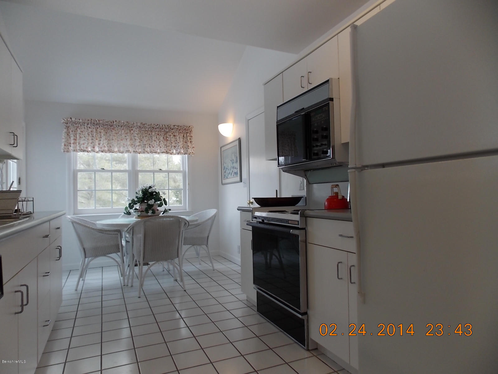 1136-9 Barker Road, Unit 9 Pittsfield, MA 01201 - Photo 9 of 45 a kitchen with a sink and a stove top oven