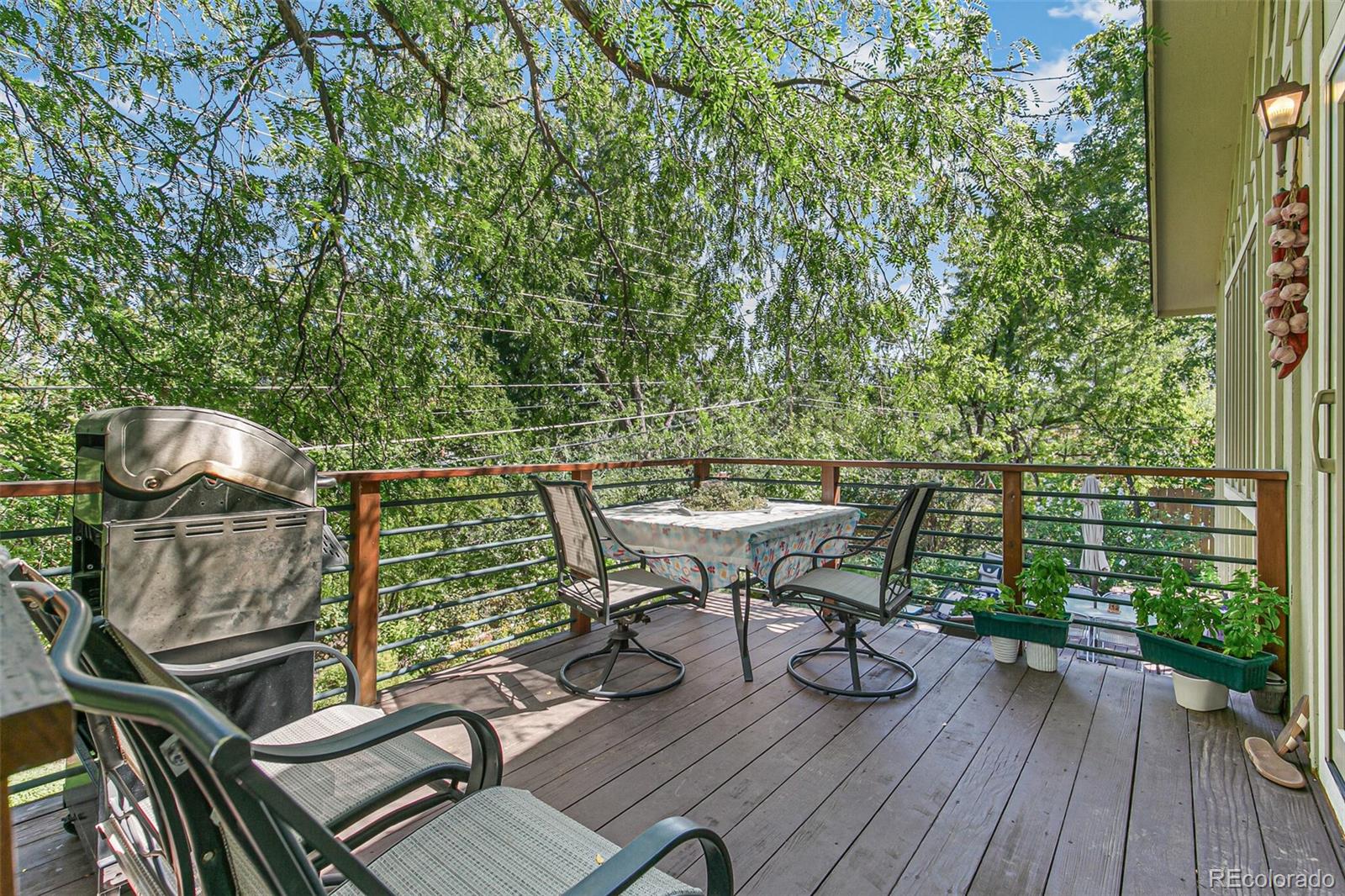 1080 Ithaca Drive Boulder, CO 80305 - Photo 16 of 35 a view of a balcony with chairs and wooden floor