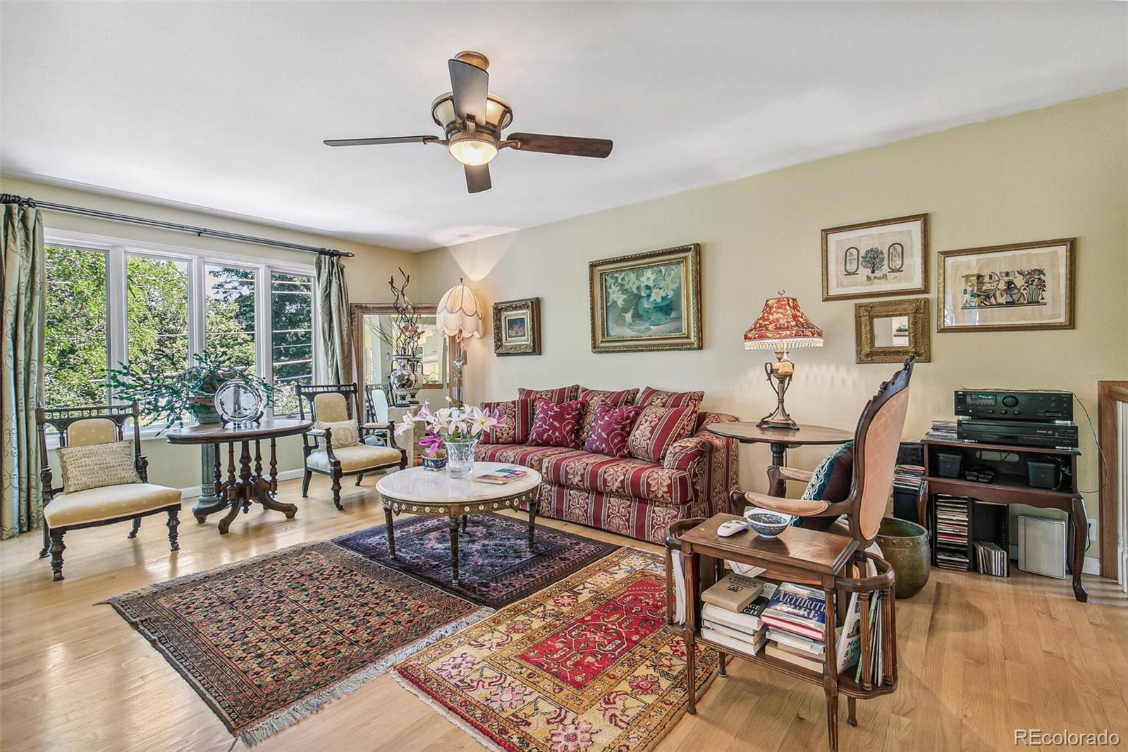 1080 Ithaca Drive Boulder, CO 80305 - Photo 17 of 35 a living room with furniture a rug and a large window